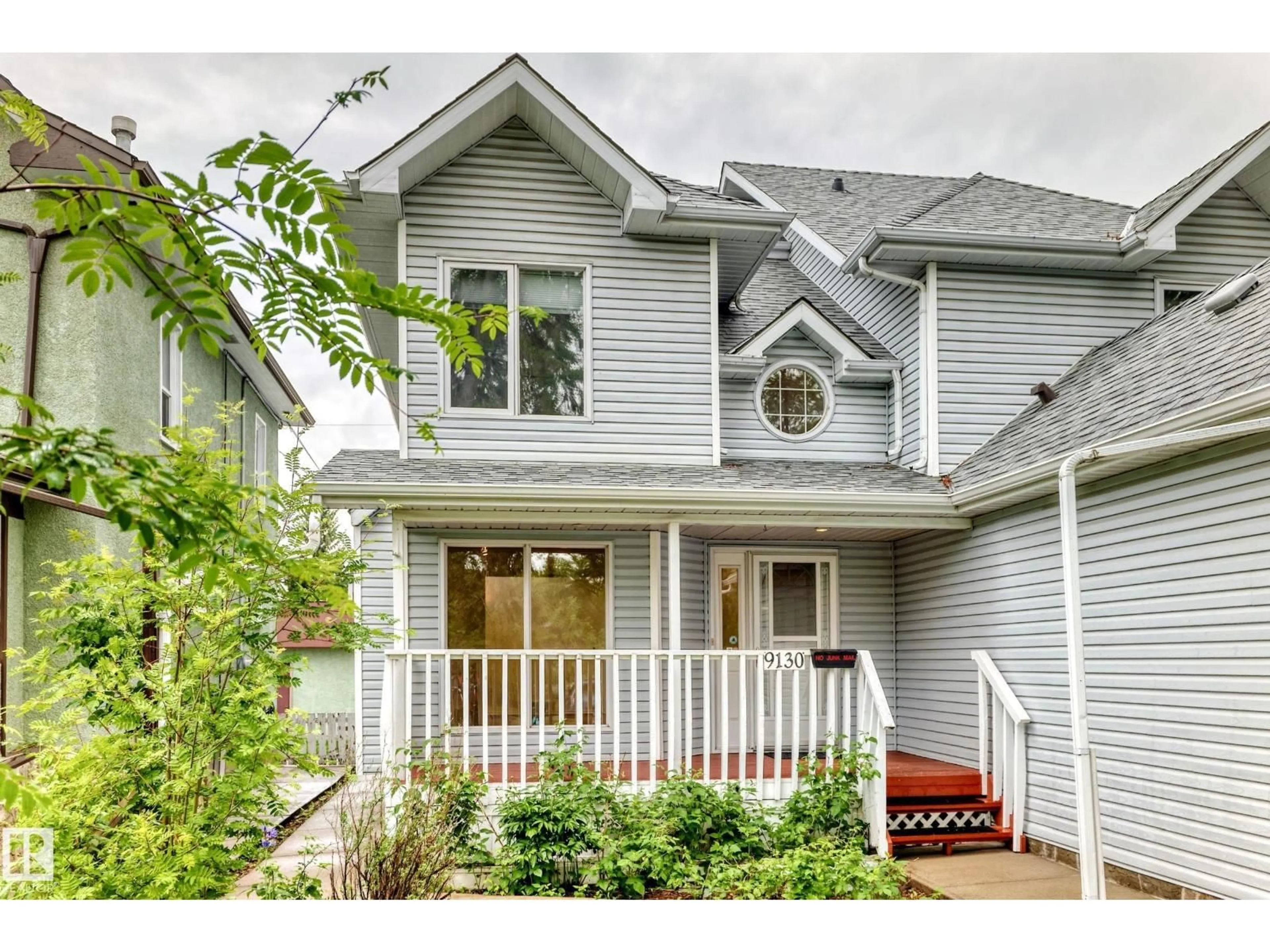 Home with vinyl exterior material, street for 9130 77 AV, Edmonton Alberta T6C0M2