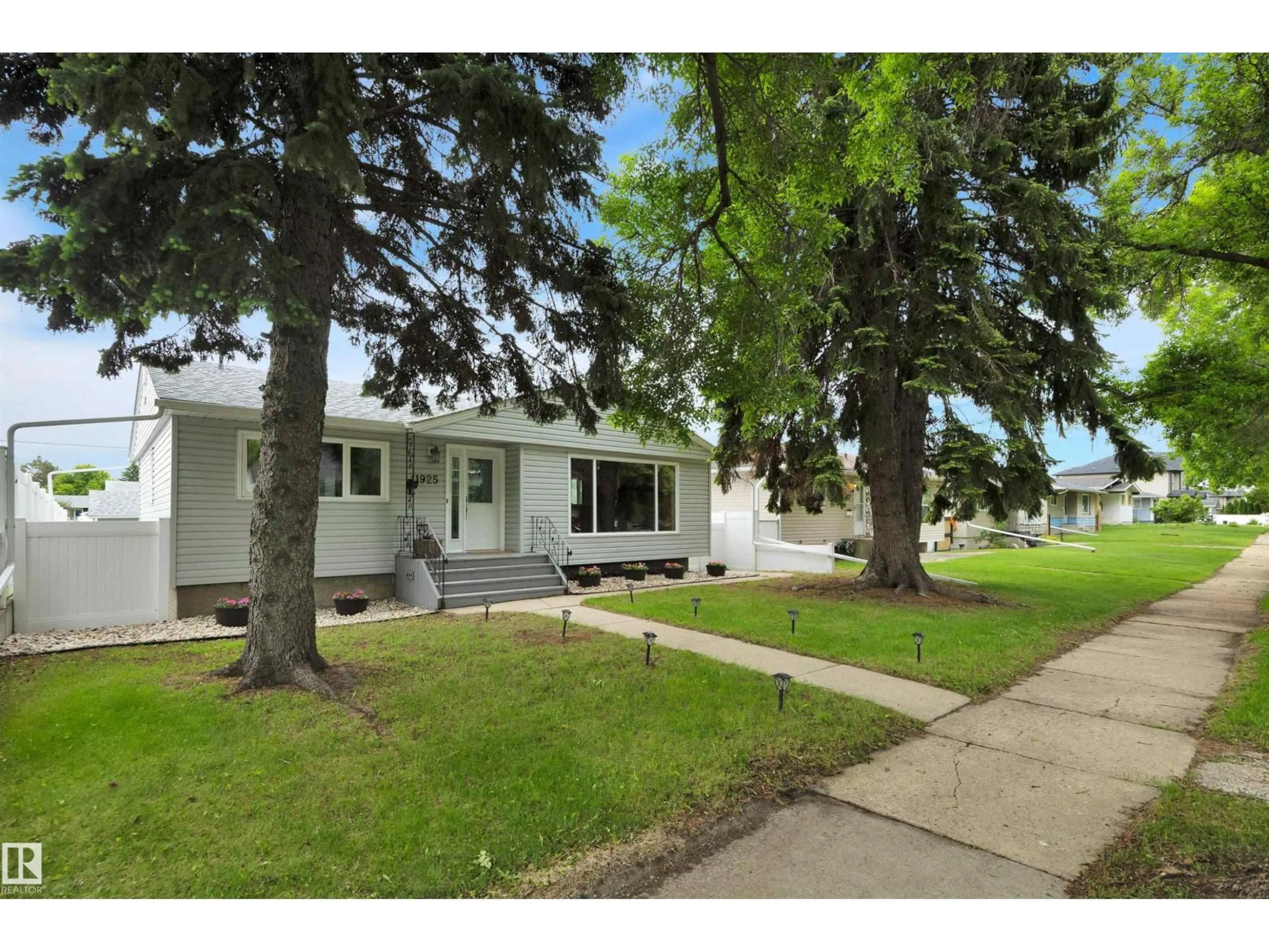 Home with vinyl exterior material, street for NW - 11925 37 ST, Edmonton Alberta T5W2B9