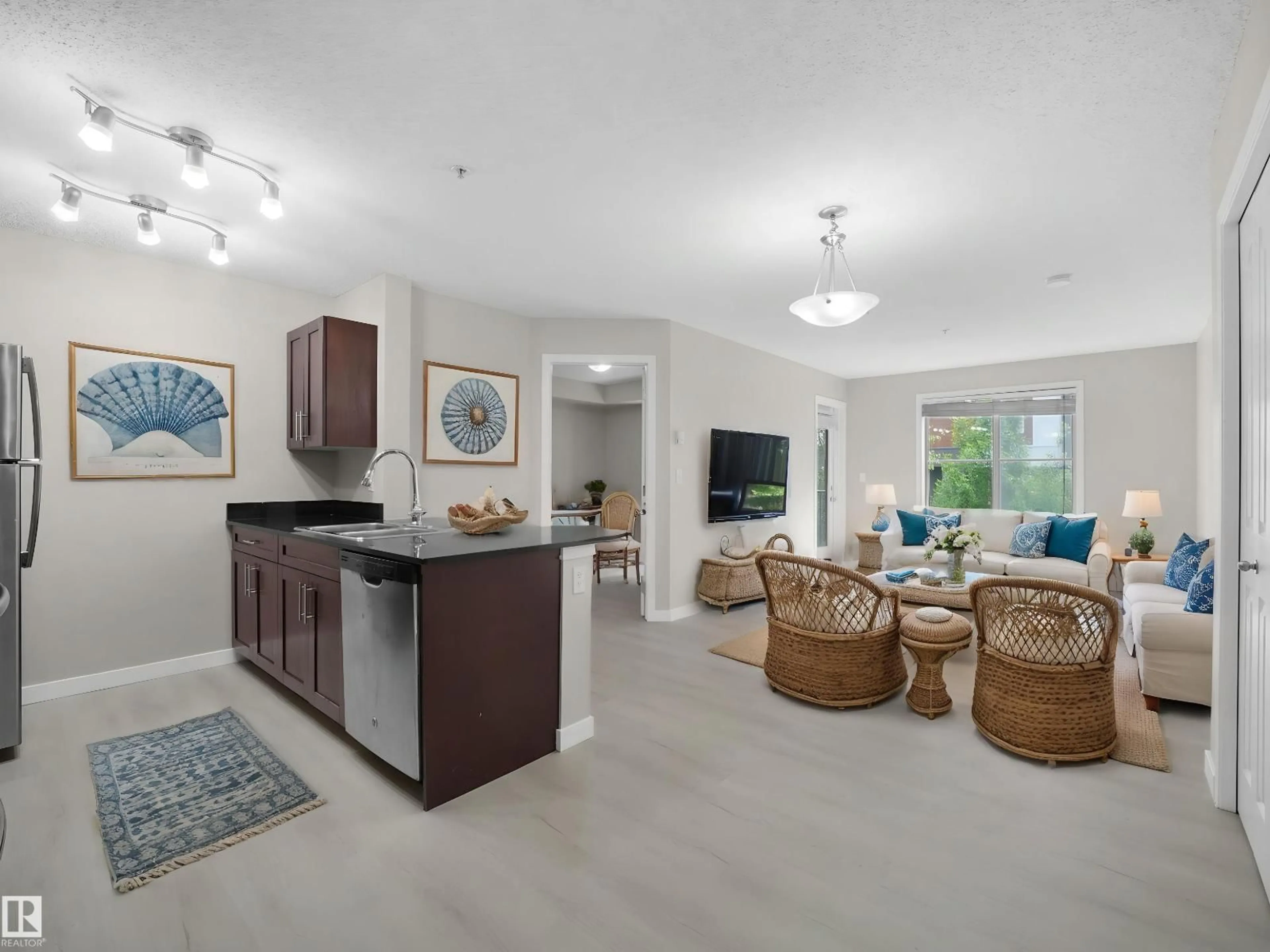 Living room with furniture, ceramic/tile floor for SW - 220 12035 22 AV, Edmonton Alberta T6W2X9