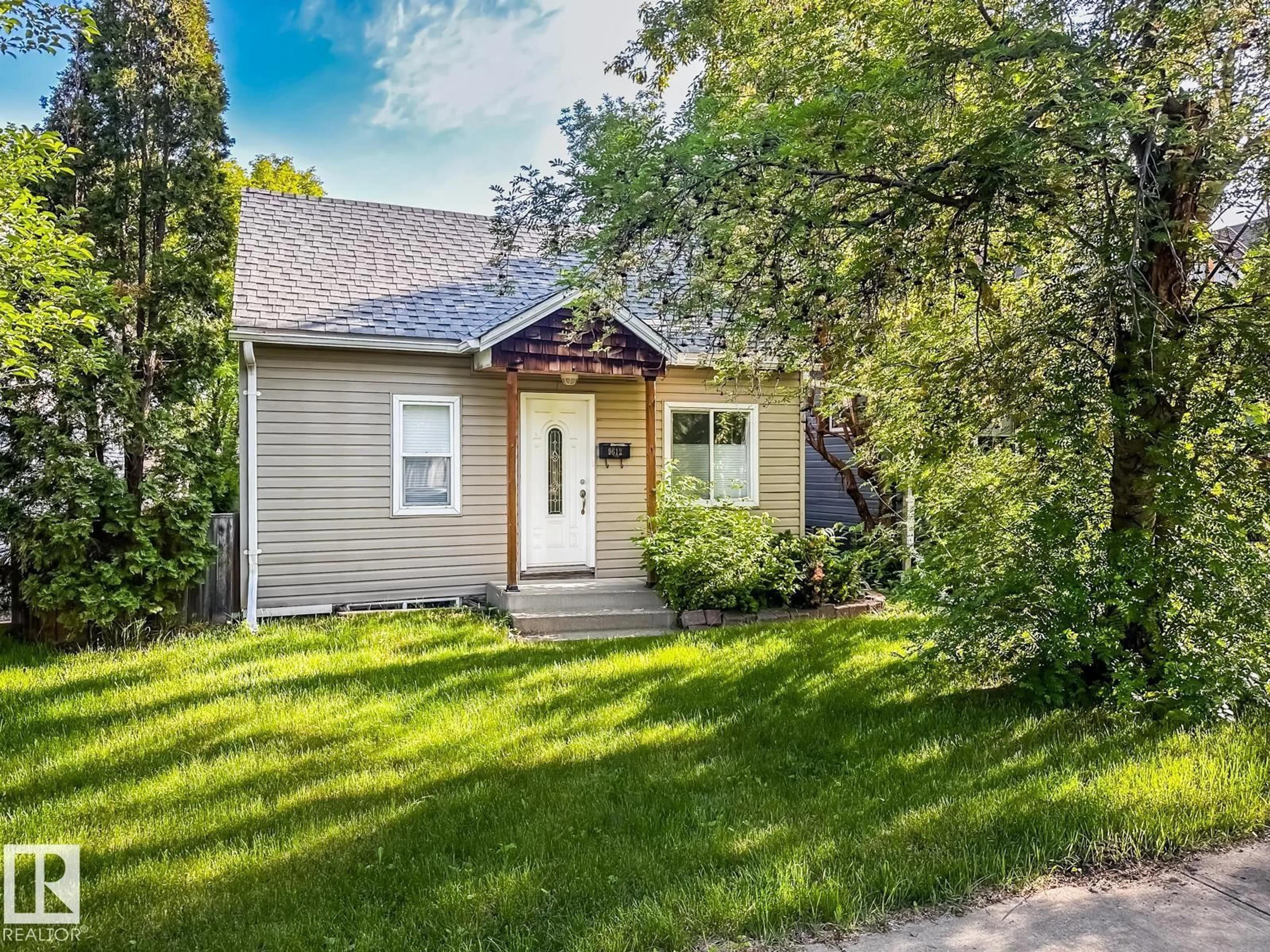 Home with vinyl exterior material, street for 9612 74 AV, Edmonton Alberta T6E1E6
