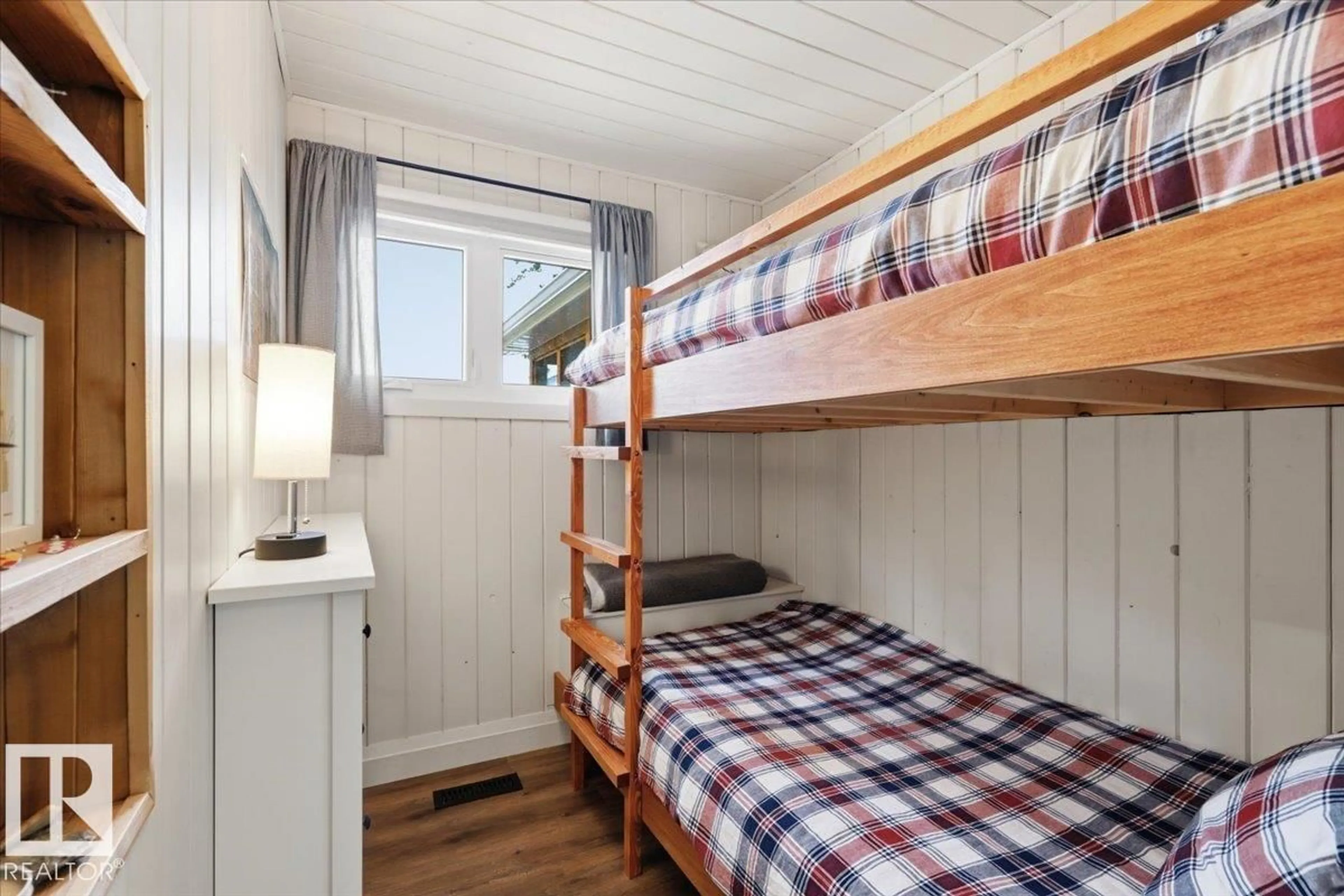 Bedroom with bed, wood/laminate floor for 219 POPLAR CV, Rural Wetaskiwin County Alberta T0C2V0