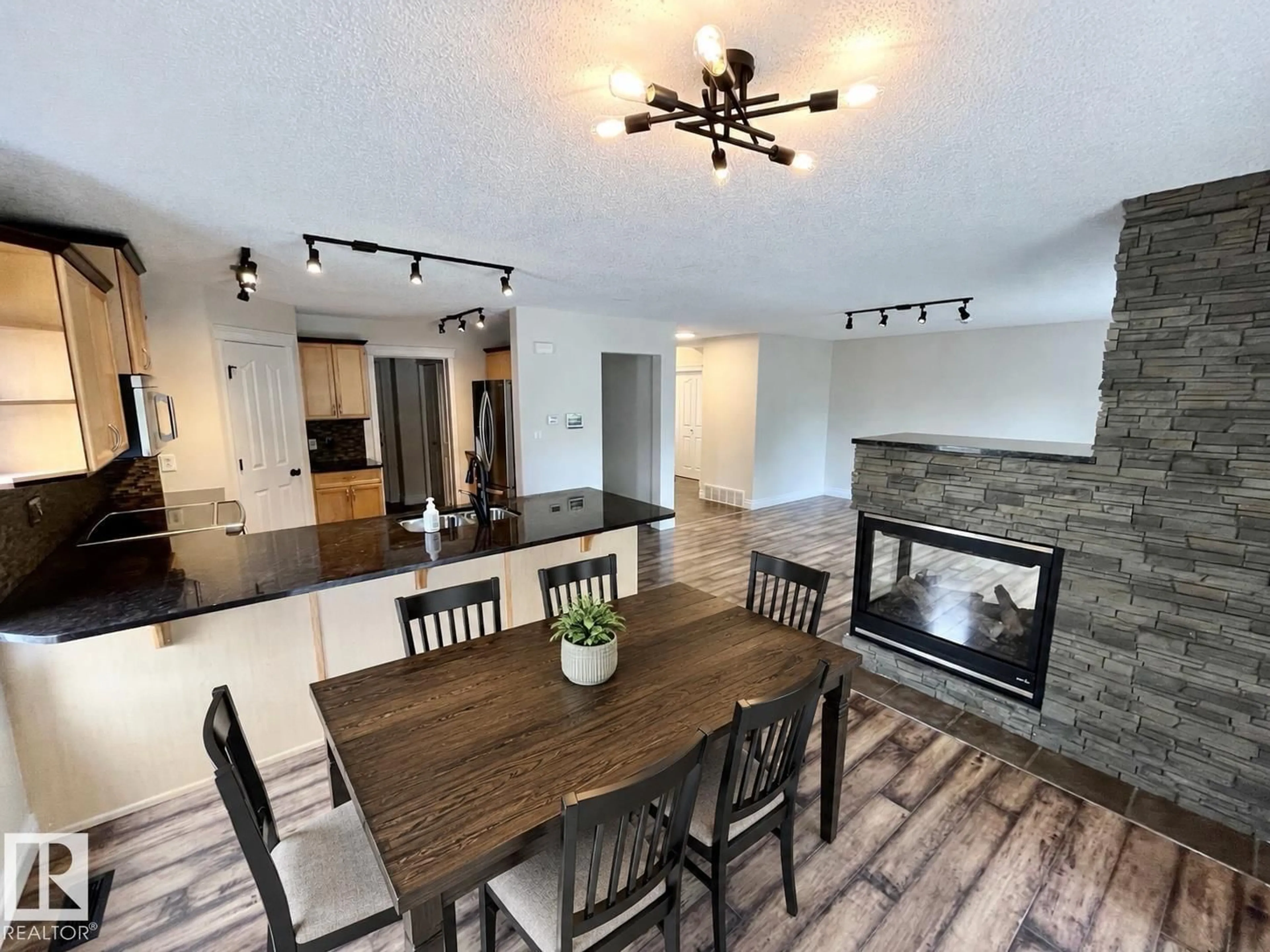 Open concept kitchen, wood/laminate floor for 10 ERICKSON CL, St. Albert Alberta T8N7G5