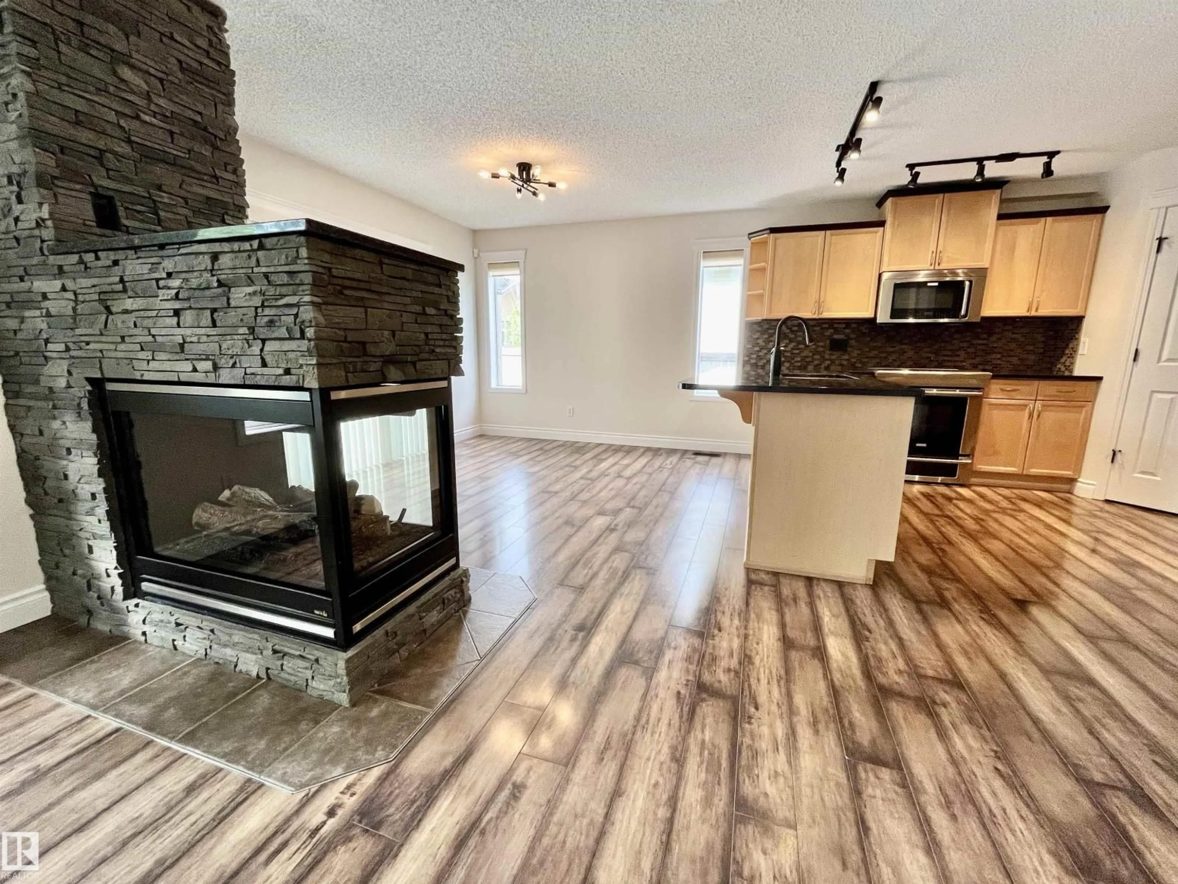 Open concept kitchen, wood/laminate floor for 10 ERICKSON CL, St. Albert Alberta T8N7G5