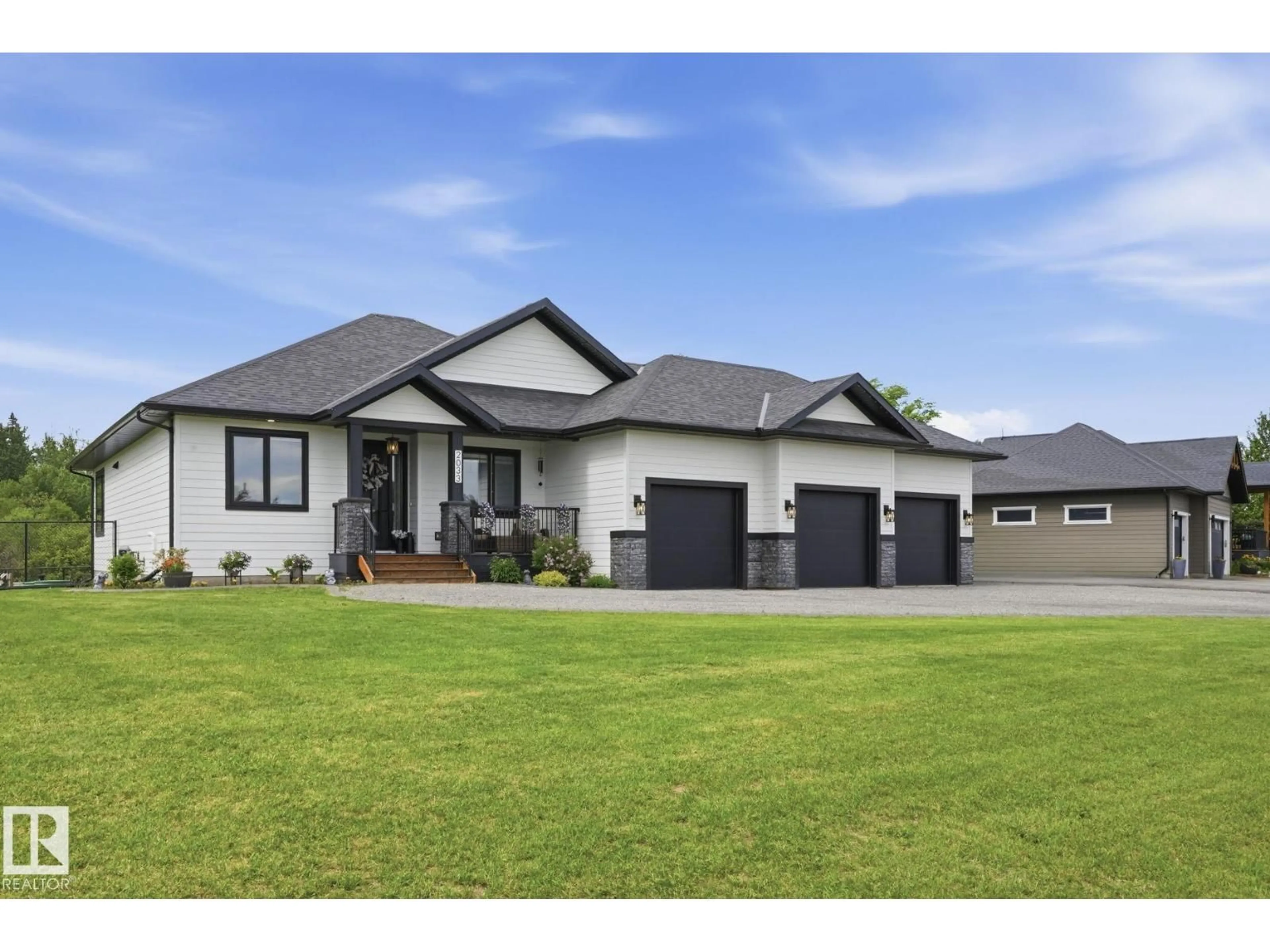 Home with vinyl exterior material, street for 2033 SPRING LAKE DR, Rural Parkland County Alberta T7Z0G8