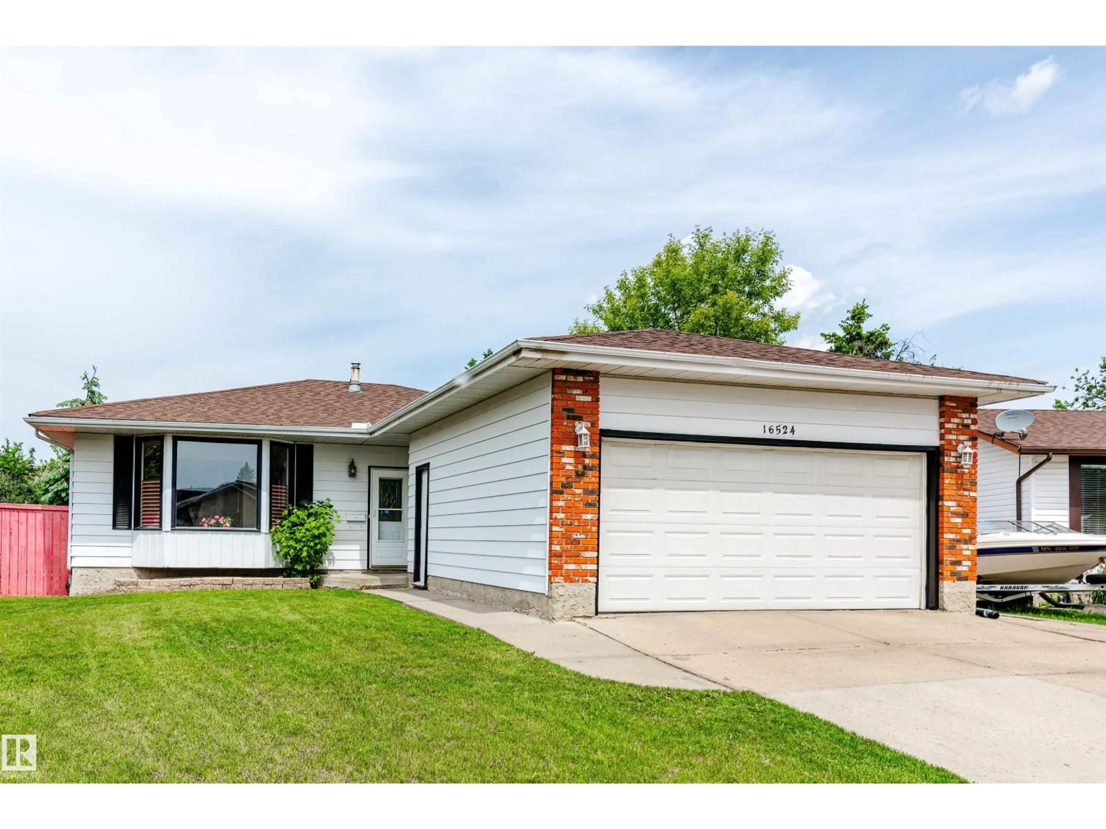 Home with vinyl exterior material, street for NW - 16524 116 ST, Edmonton Alberta T5X3T8
