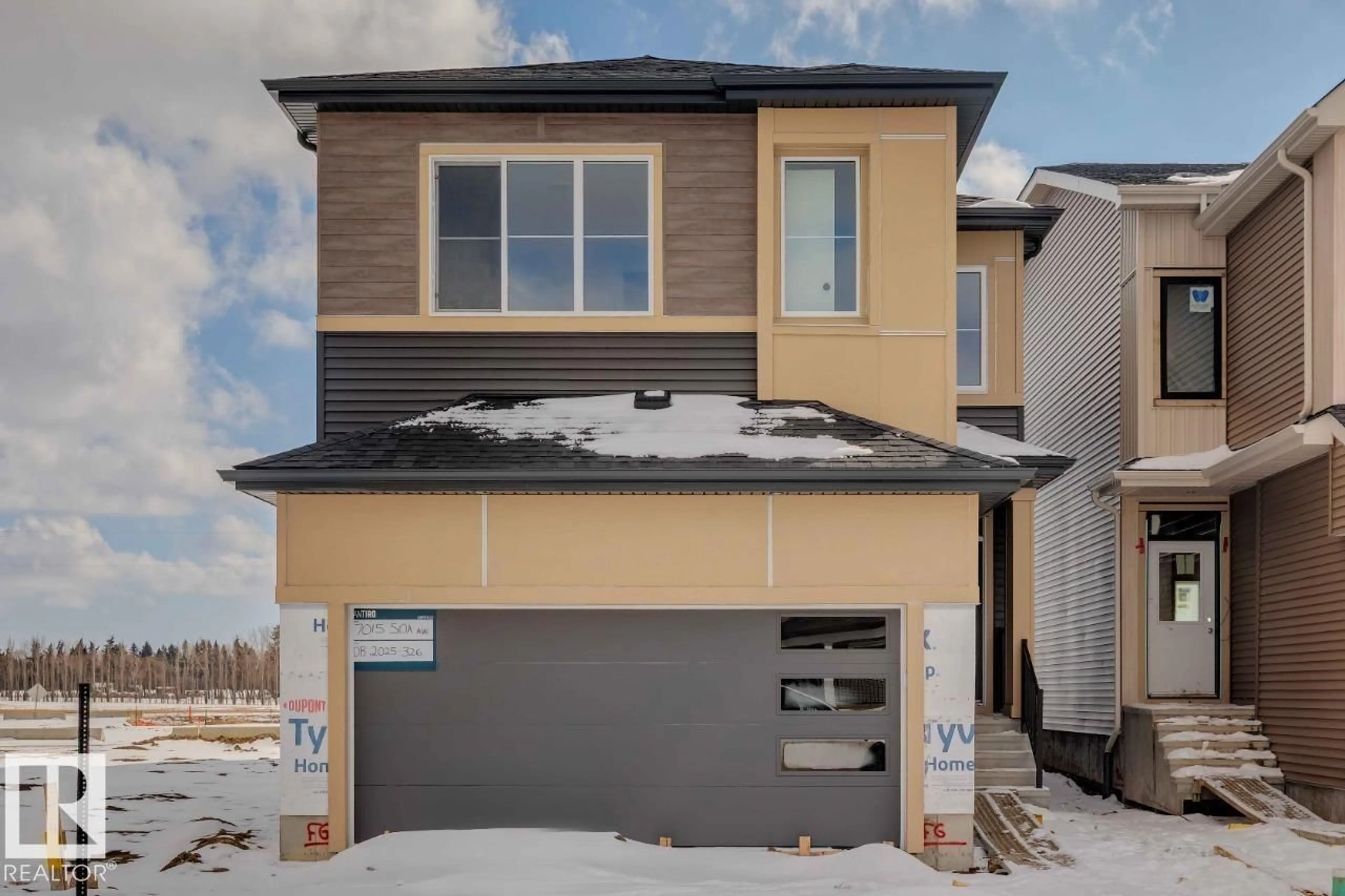 Home with vinyl exterior material, street for 7015 50A AV, Beaumont Alberta T4X2Z3