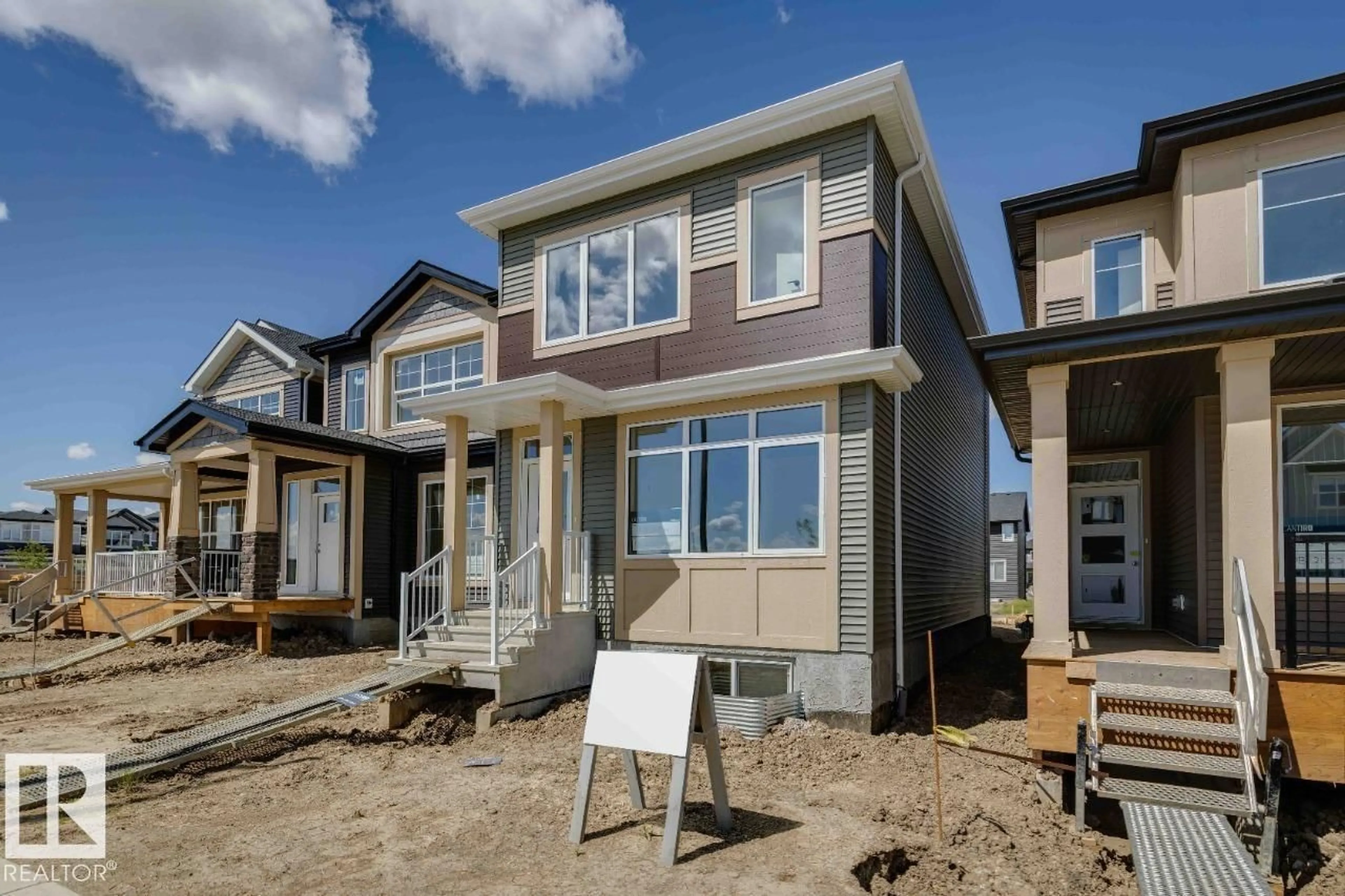 Home with vinyl exterior material, street for 7118 50A AV, Beaumont Alberta T4X2Z8