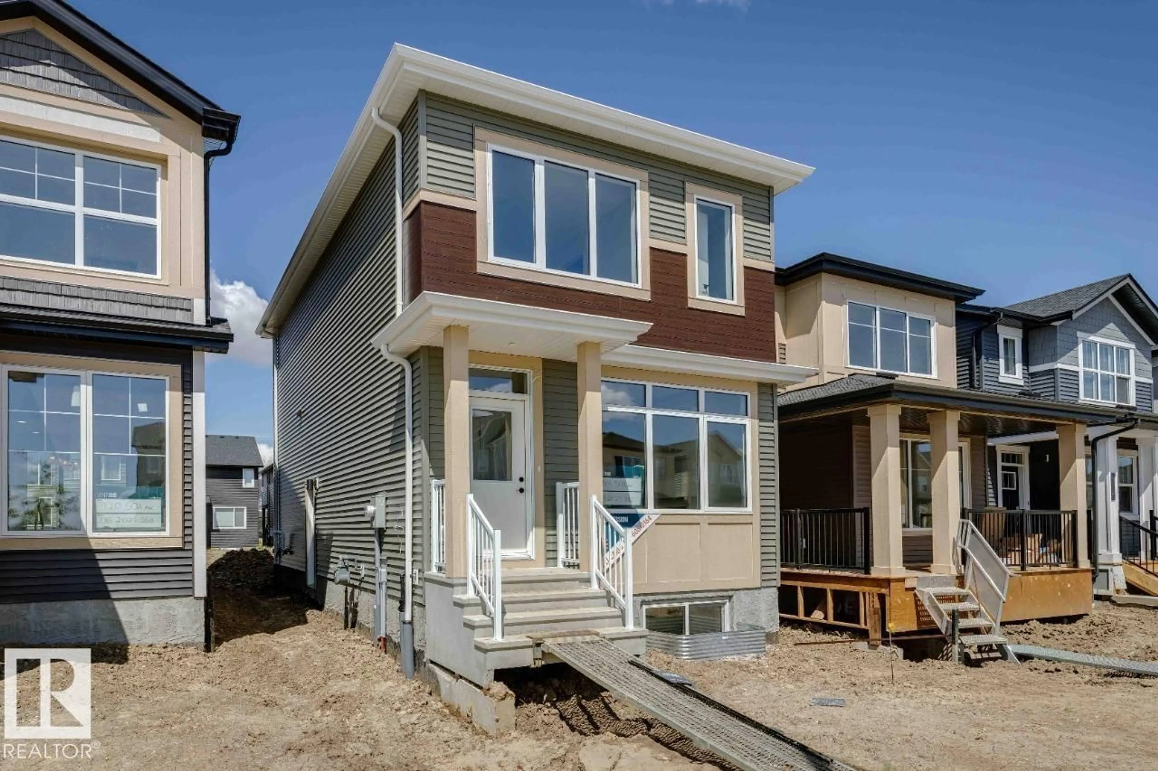 Home with vinyl exterior material, street for 7118 50A AV, Beaumont Alberta T4X2Z8
