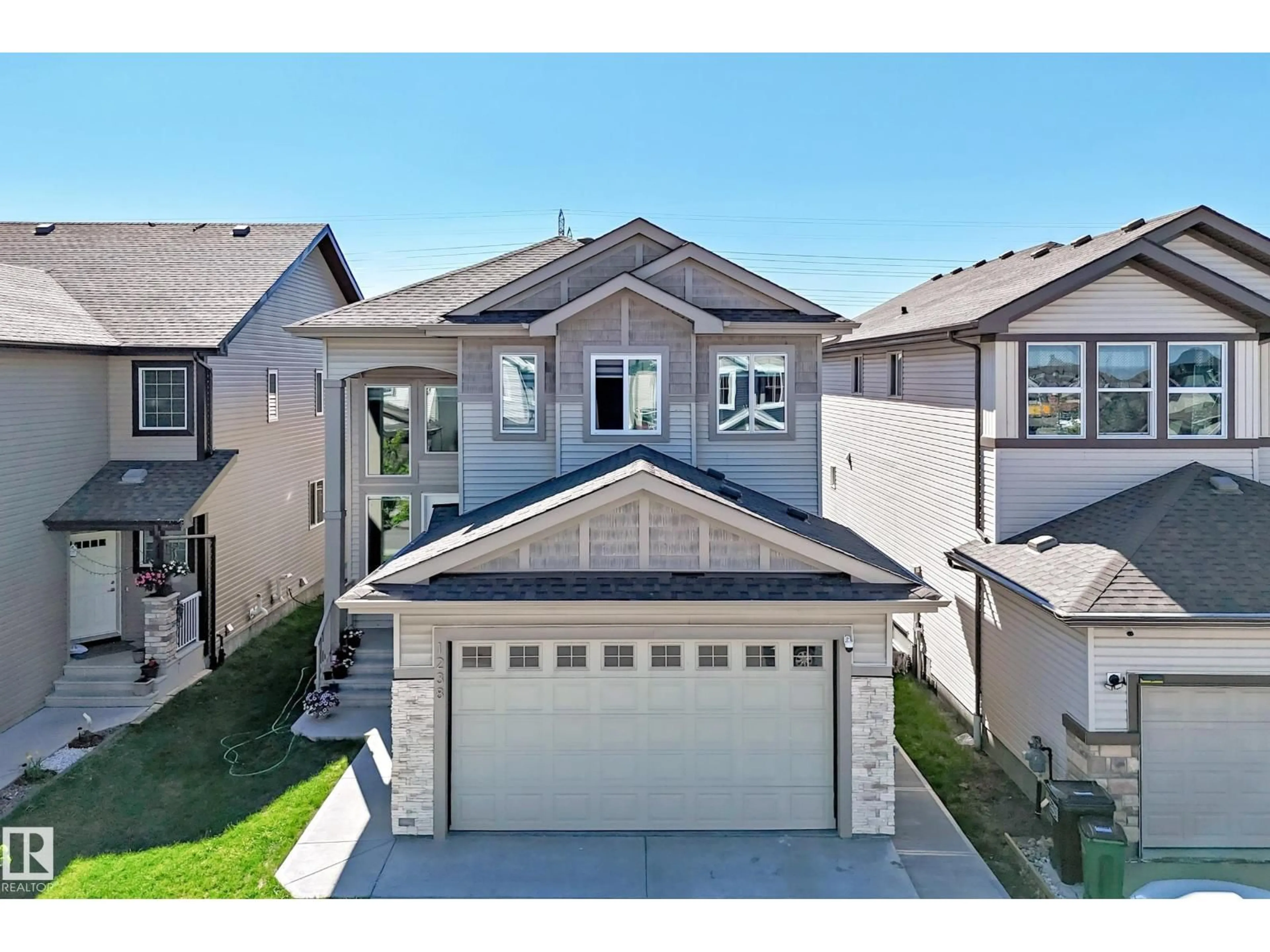 Home with vinyl exterior material, street for NW - 1238 26A ST, Edmonton Alberta T6T2J4