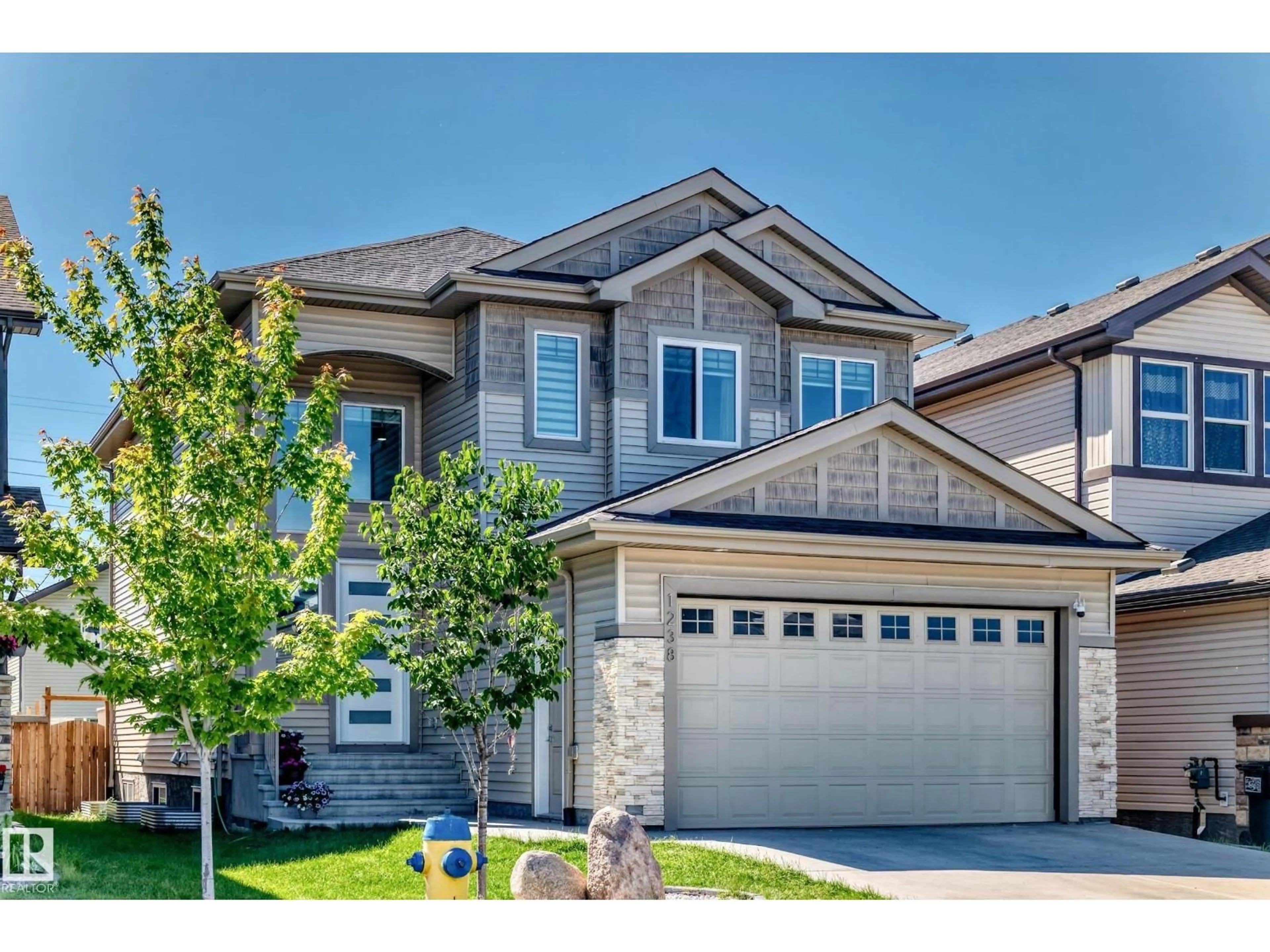 Home with vinyl exterior material, street for NW - 1238 26A ST, Edmonton Alberta T6T2J4