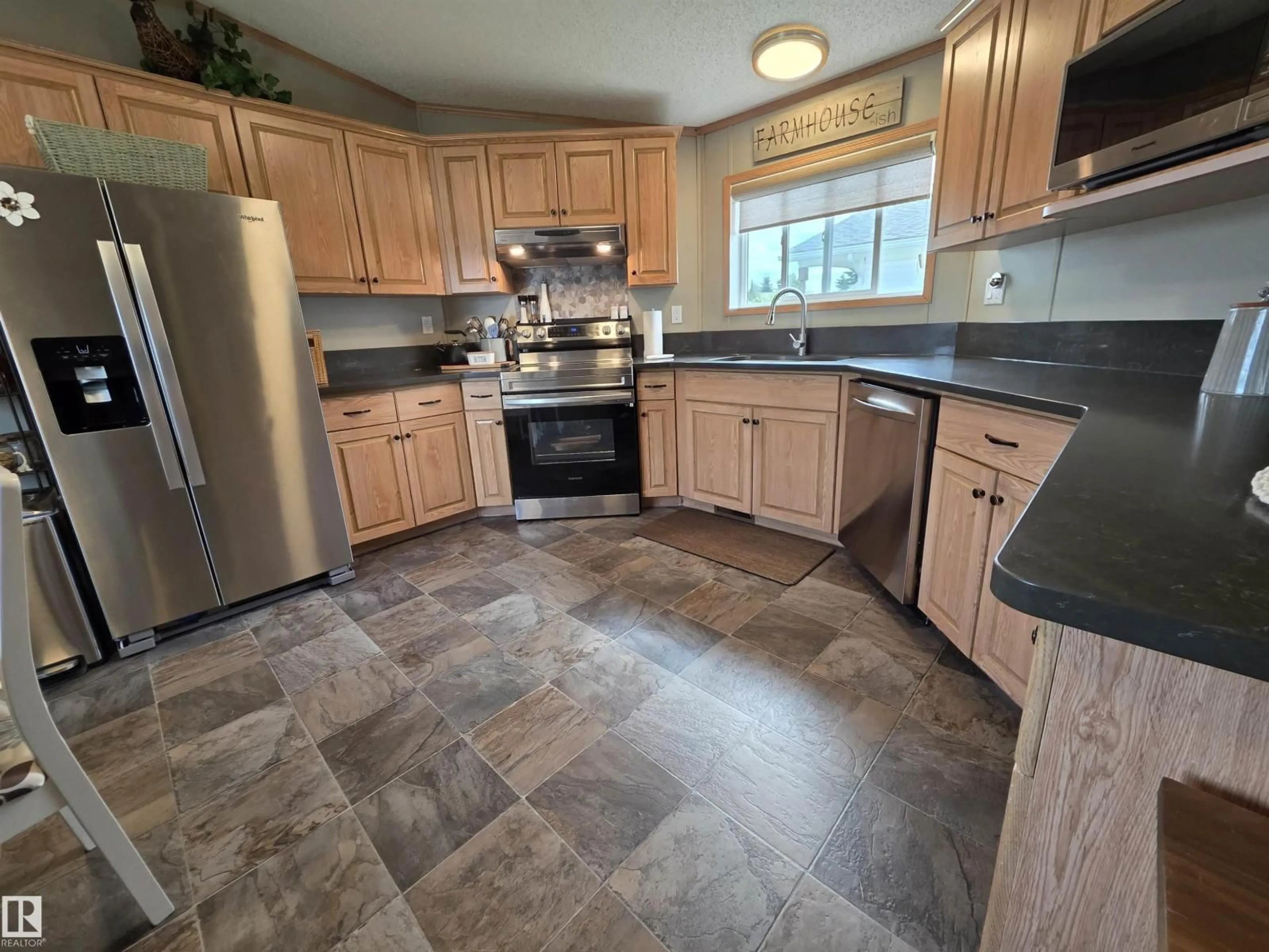 Open concept kitchen, ceramic/tile floor for 88B - 3400 48 ST, Stony Plain Alberta T7Z1S1