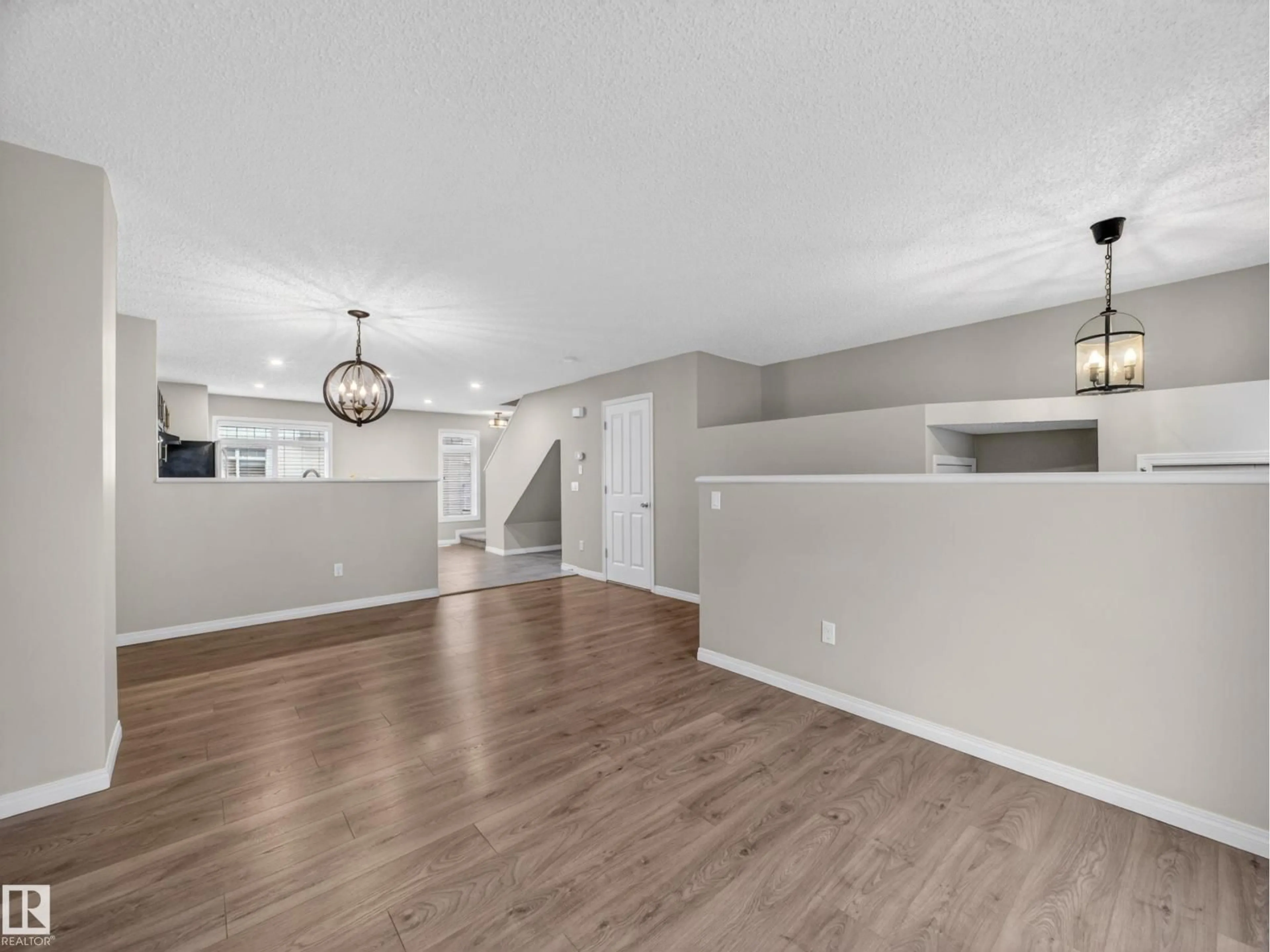 Open concept kitchen, wood/laminate floor for #31 - 1804 70 ST, Edmonton Alberta T6X0H4
