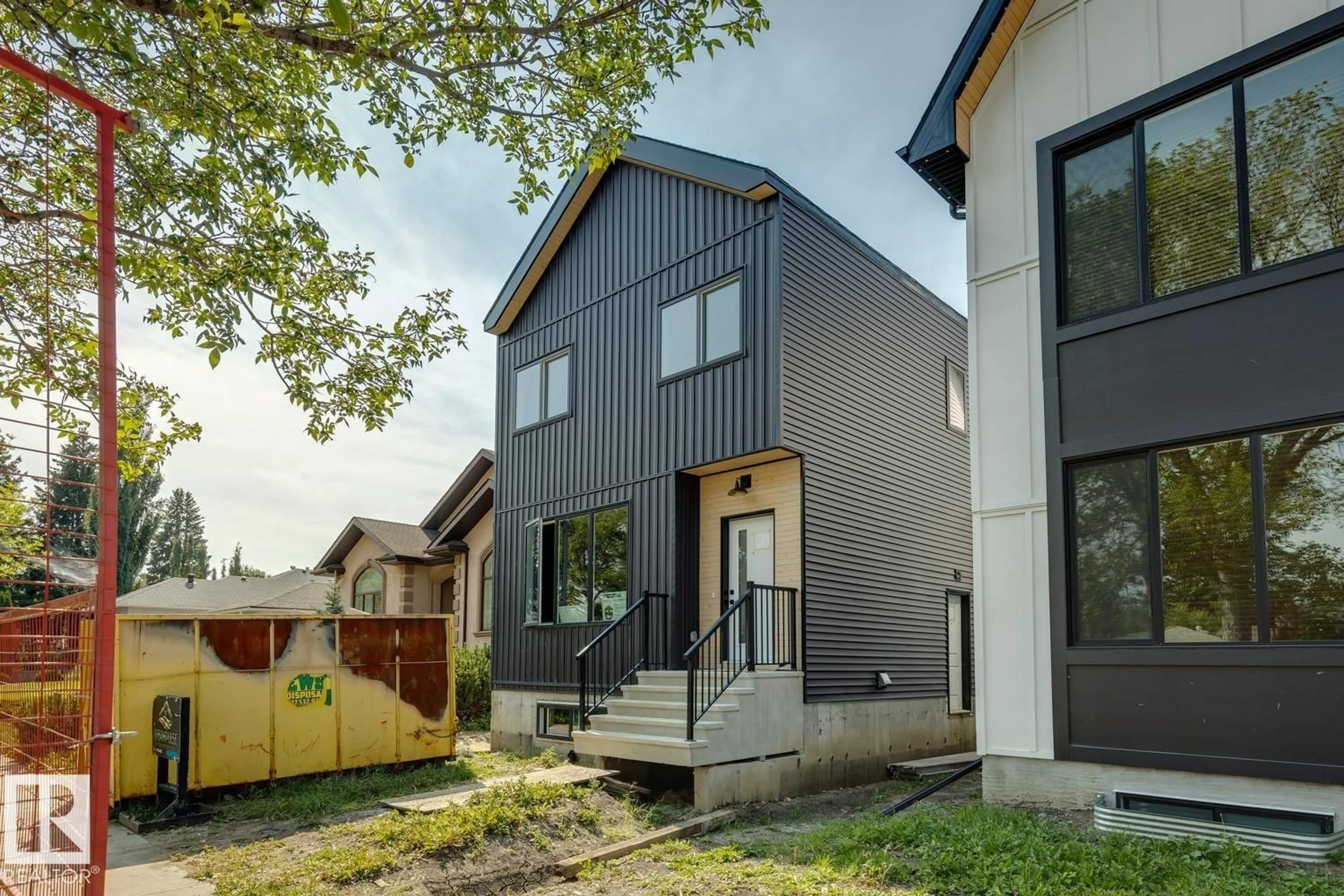 Home with vinyl exterior material, street for 11336 130 ST, Edmonton Alberta T5M1A2