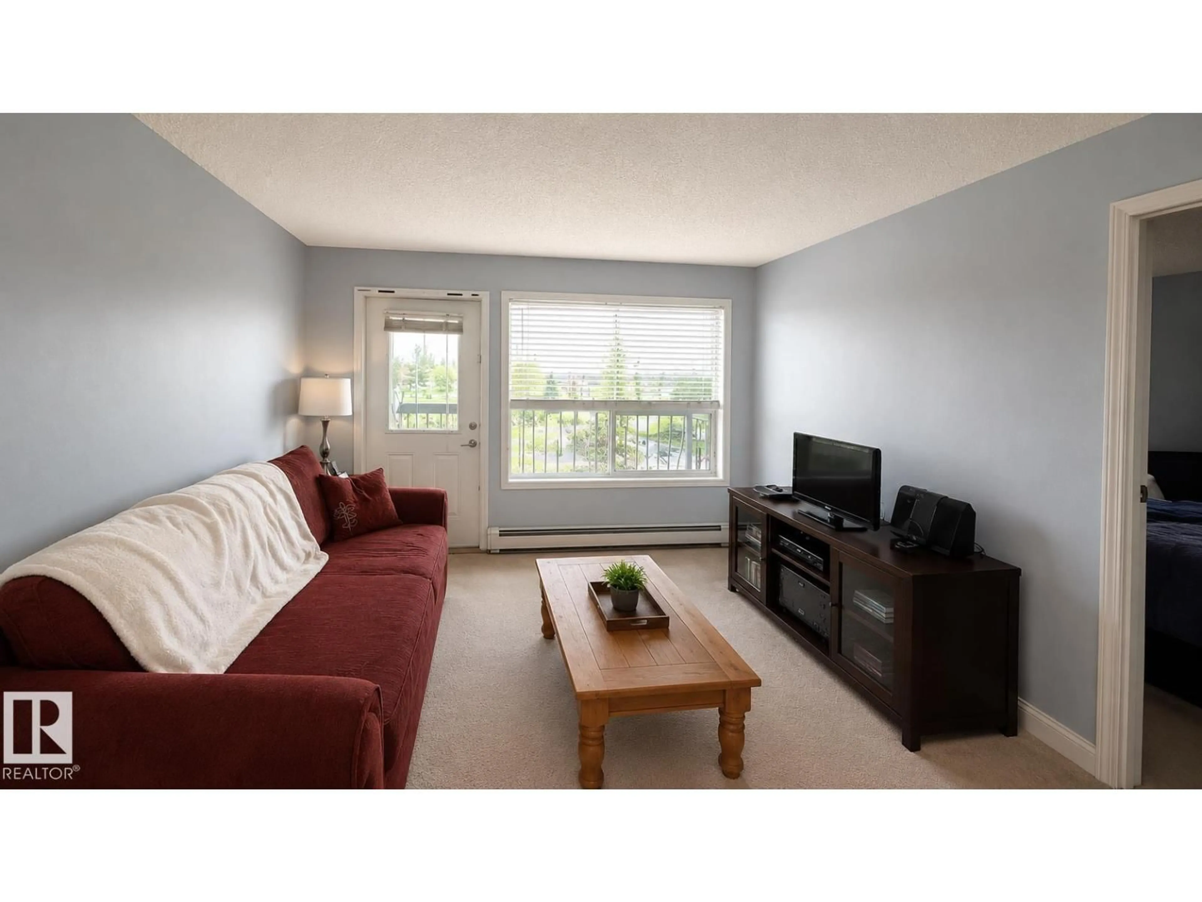 Living room with furniture, wood/laminate floor for #202 - 13635 34 ST, Edmonton Alberta T5A0C4