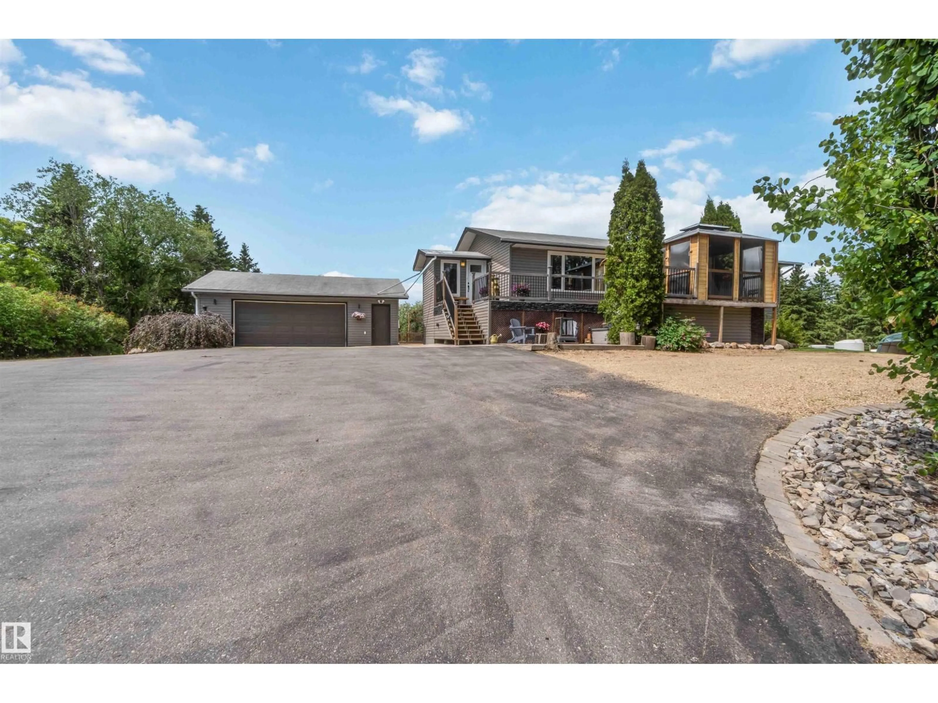 A pic from outside/outdoor area/front of a property/back of a property/a pic from drone, street for 253 22112 TWP ROAD 531, Rural Strathcona County Alberta T8E2E4