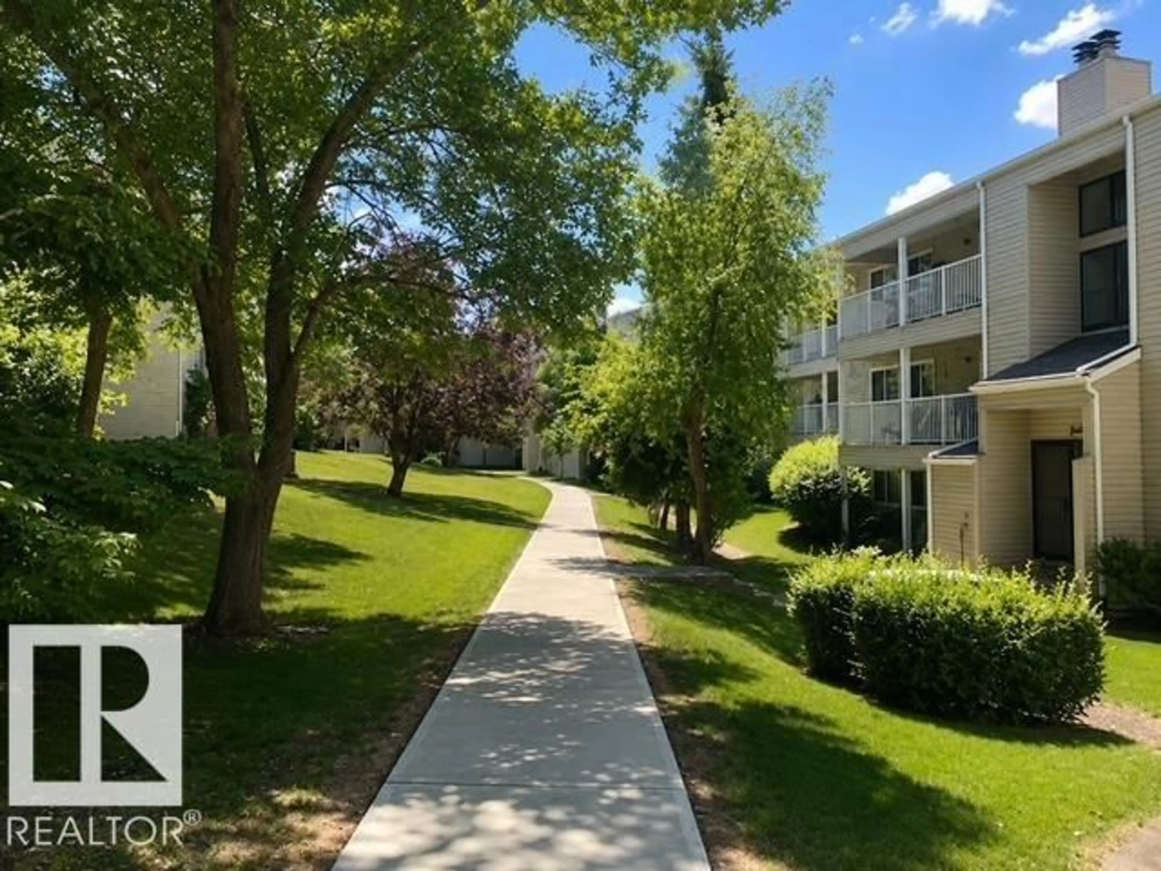 A pic from outside/outdoor area/front of a property/back of a property/a pic from drone, street for #102 - 340 WOODBRIDGE WY, Sherwood Park Alberta T8A4G3