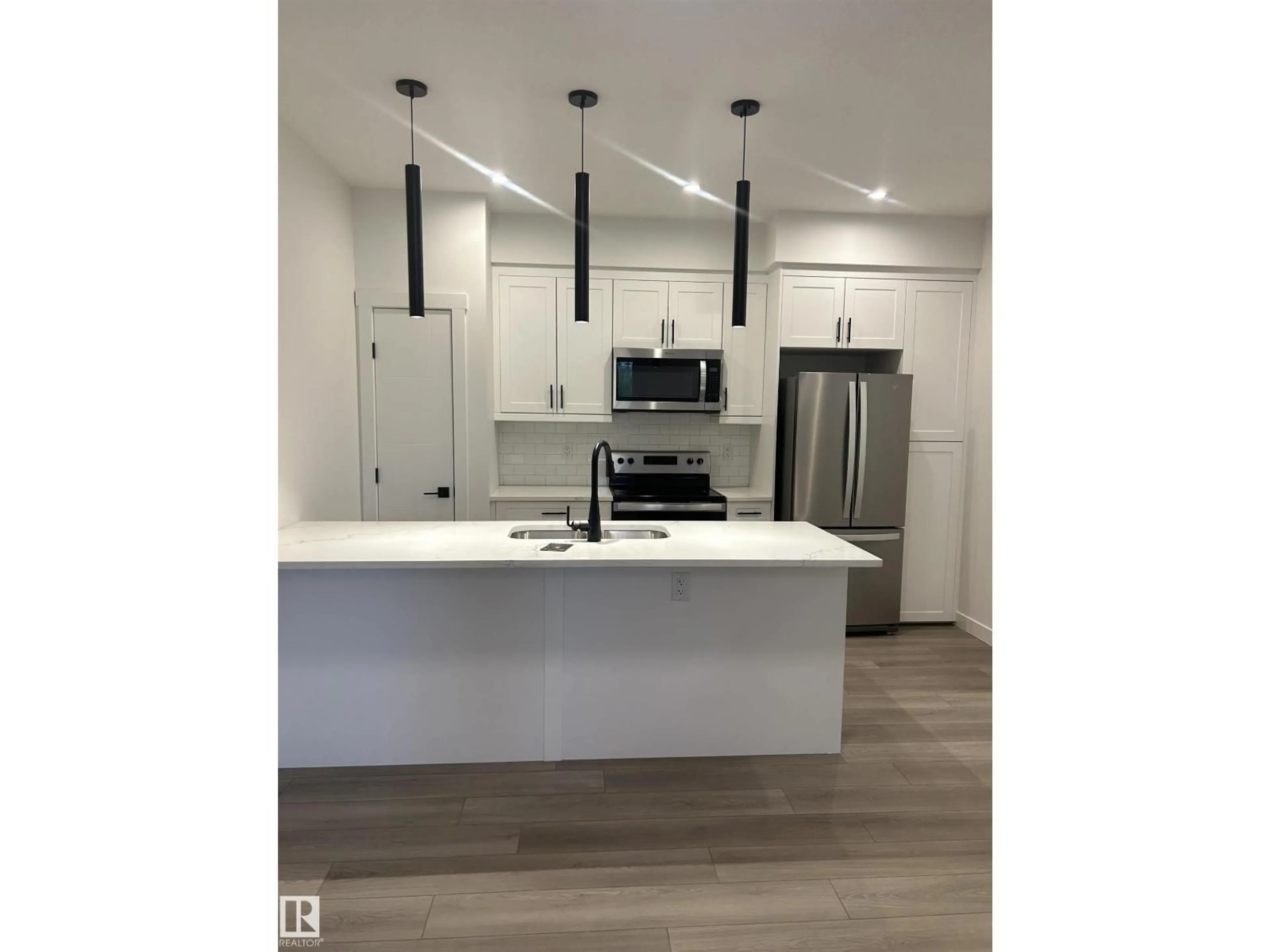 Open concept kitchen, unknown for NW - 11012 132 ST, Edmonton Alberta T5M1E2