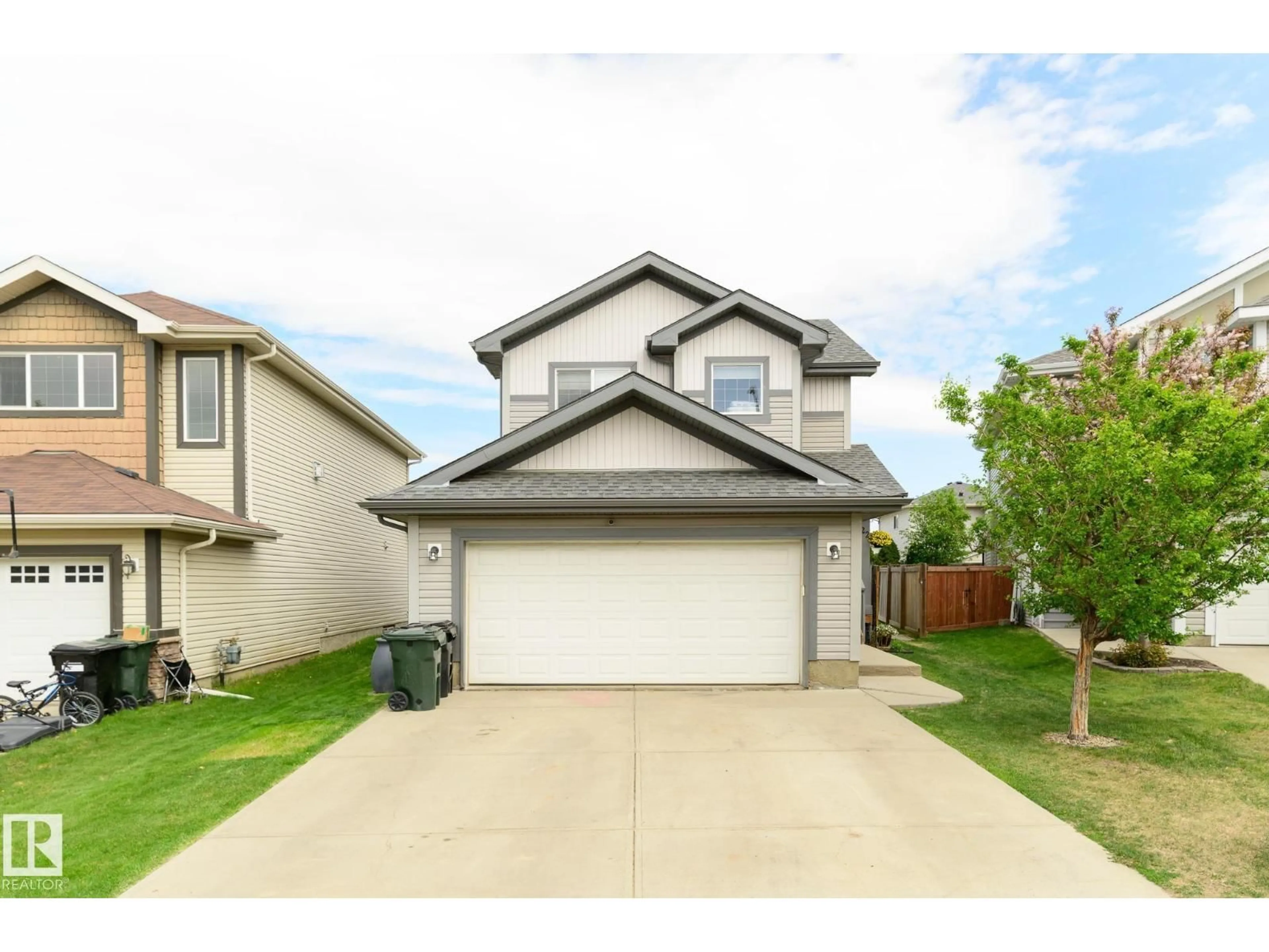 Home with vinyl exterior material, street for 22 SPRING CV, Spruce Grove Alberta T7X0L5