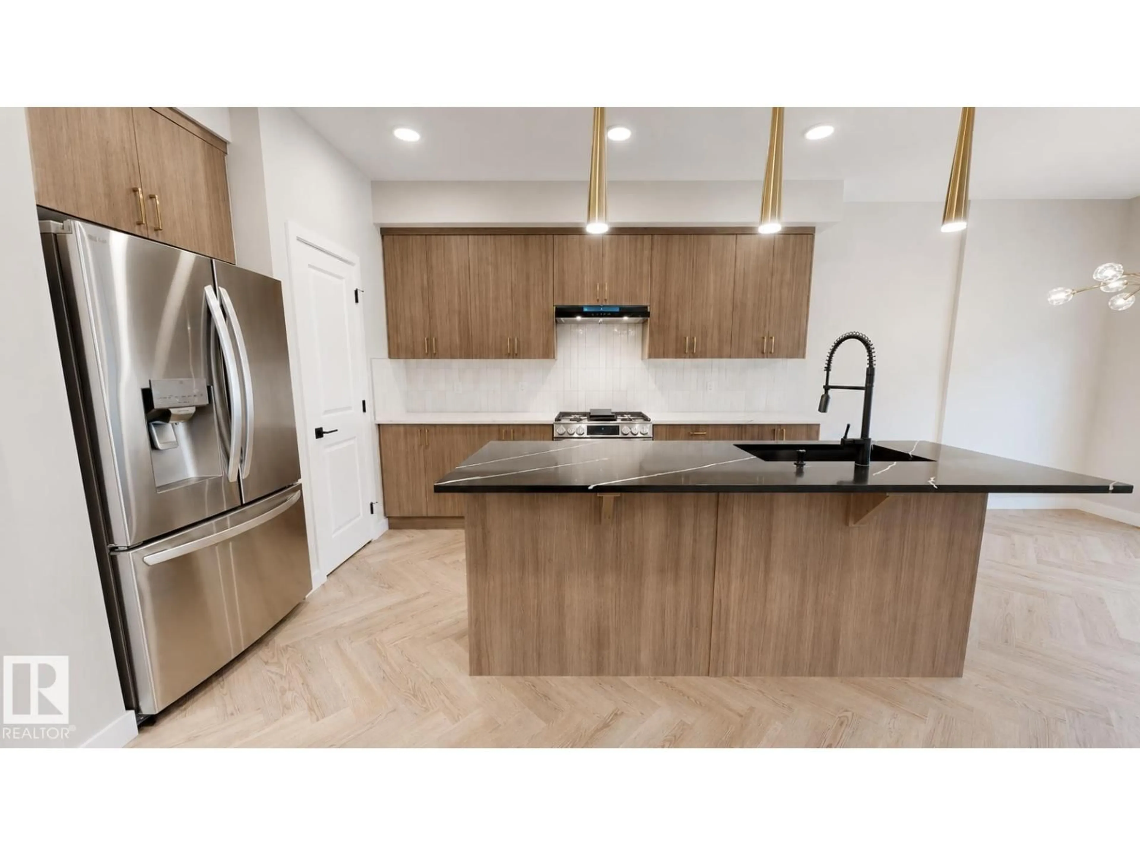 Open concept kitchen, wood/laminate floor for 6404 27 AV, Edmonton Alberta T6X3G4