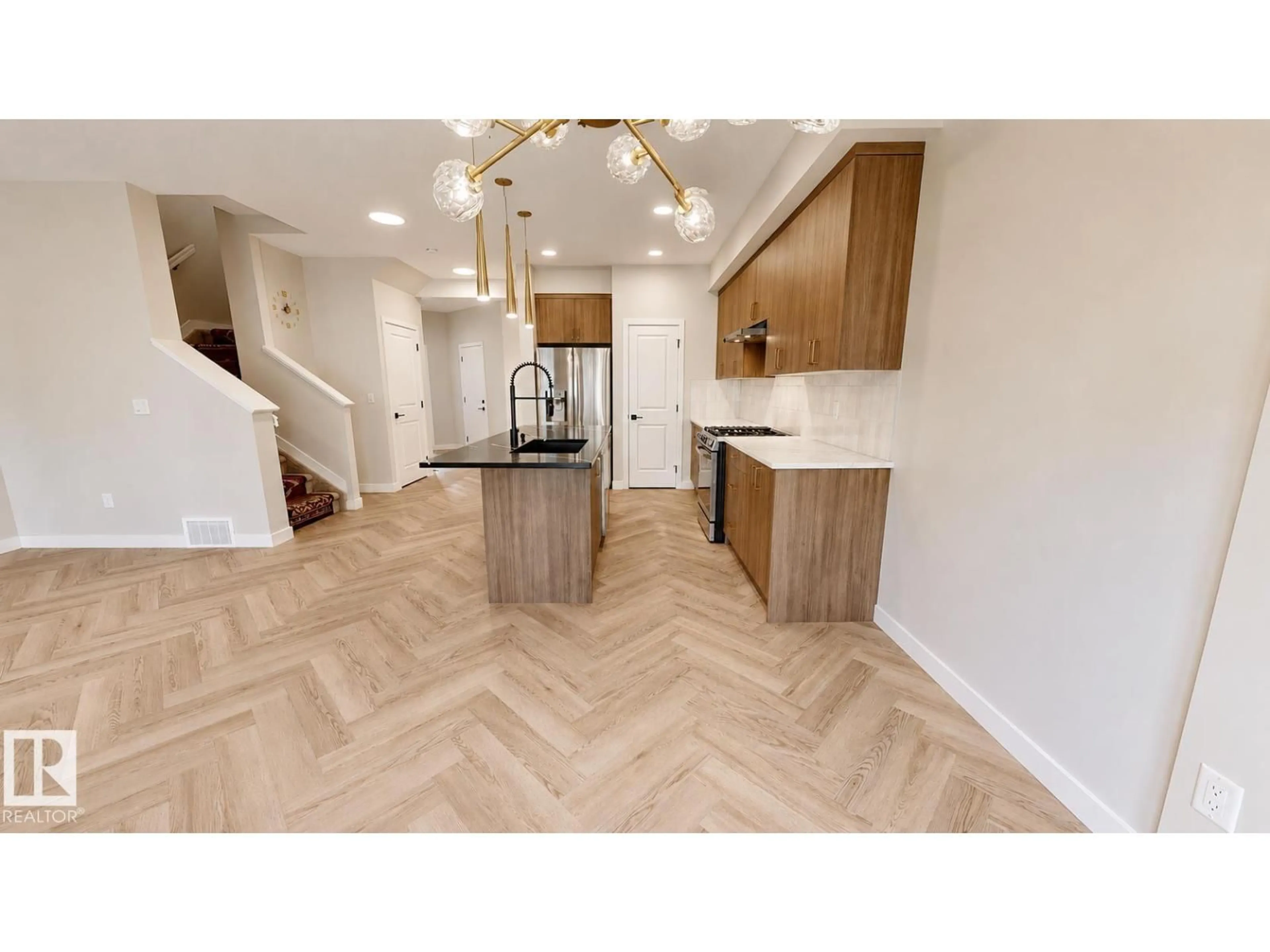 Open concept kitchen, wood/laminate floor for 6404 27 AV, Edmonton Alberta T6X3G4