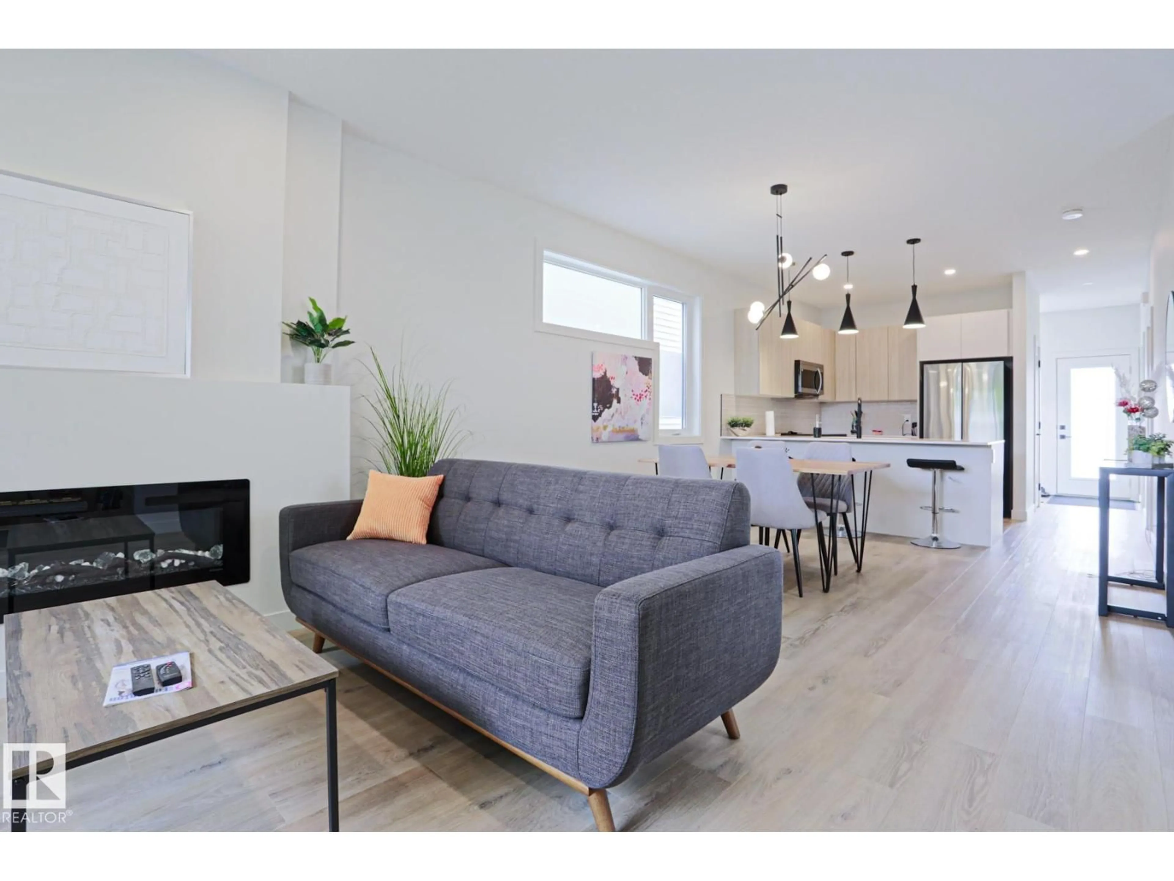 Living room with furniture, wood/laminate floor for NW - 12842 121 ST, Edmonton Alberta T5L0A9