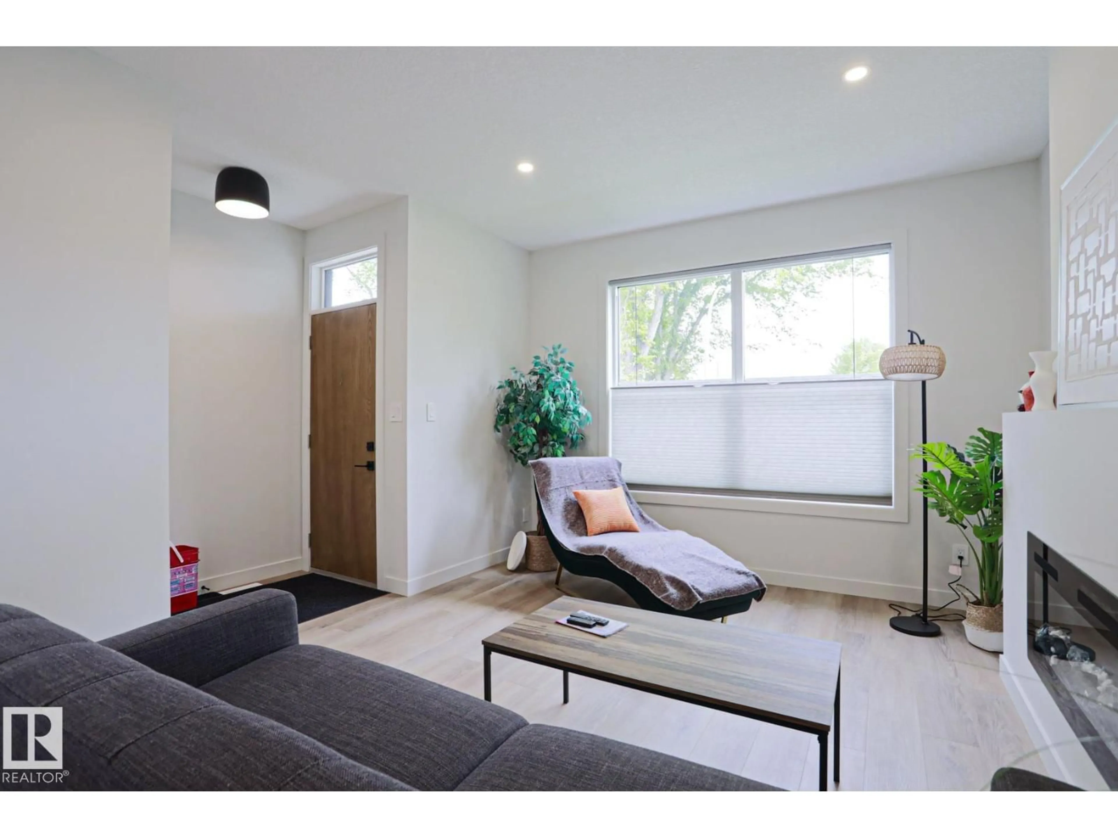 Living room with furniture, wood/laminate floor for NW - 12842 121 ST, Edmonton Alberta T5L0A9