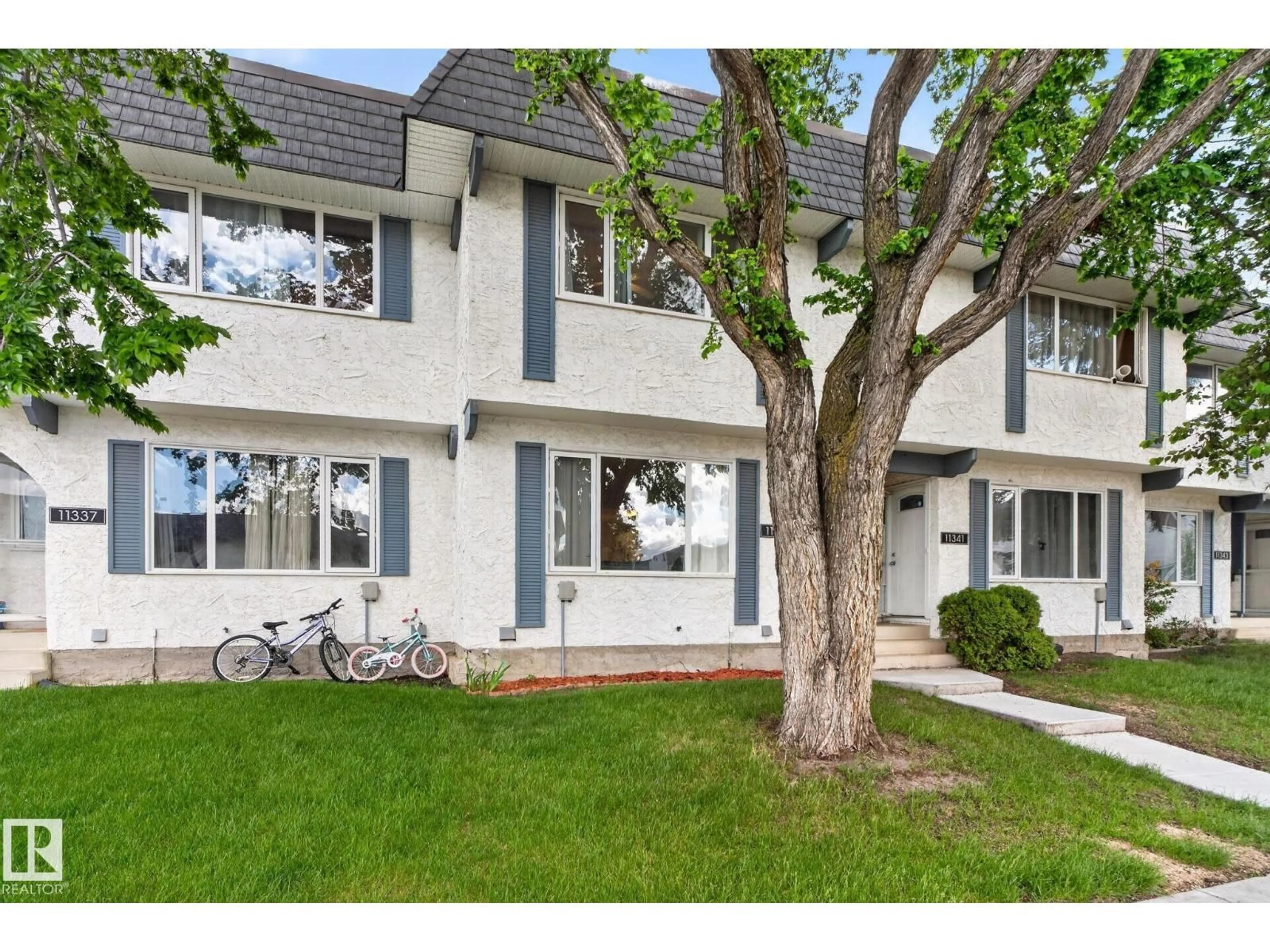 Home with vinyl exterior material, street for 11339 22 AV, Edmonton Alberta T6J4V8