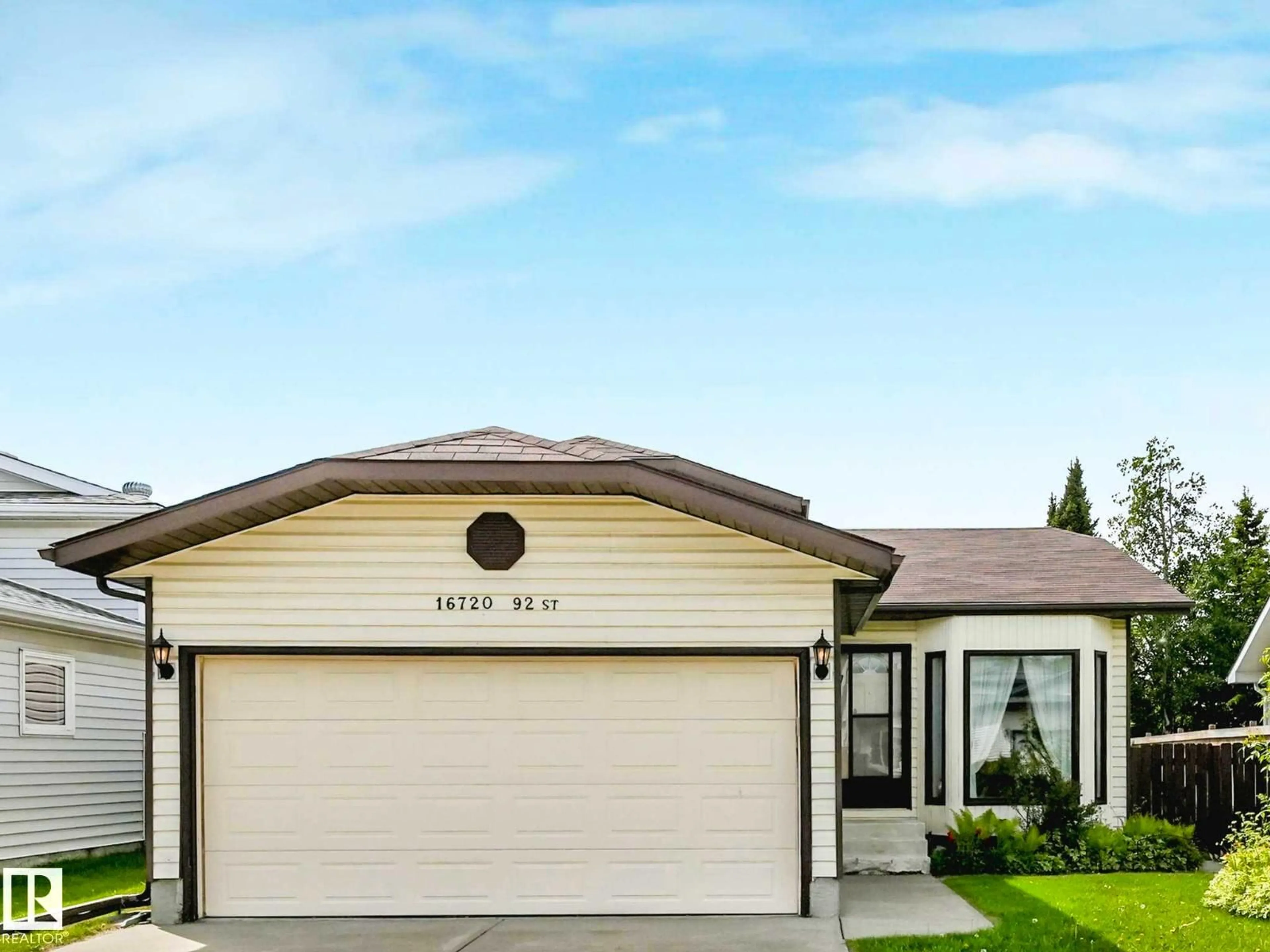 Home with vinyl exterior material, street for NW - 16720 92 ST, Edmonton Alberta T5Z2W2