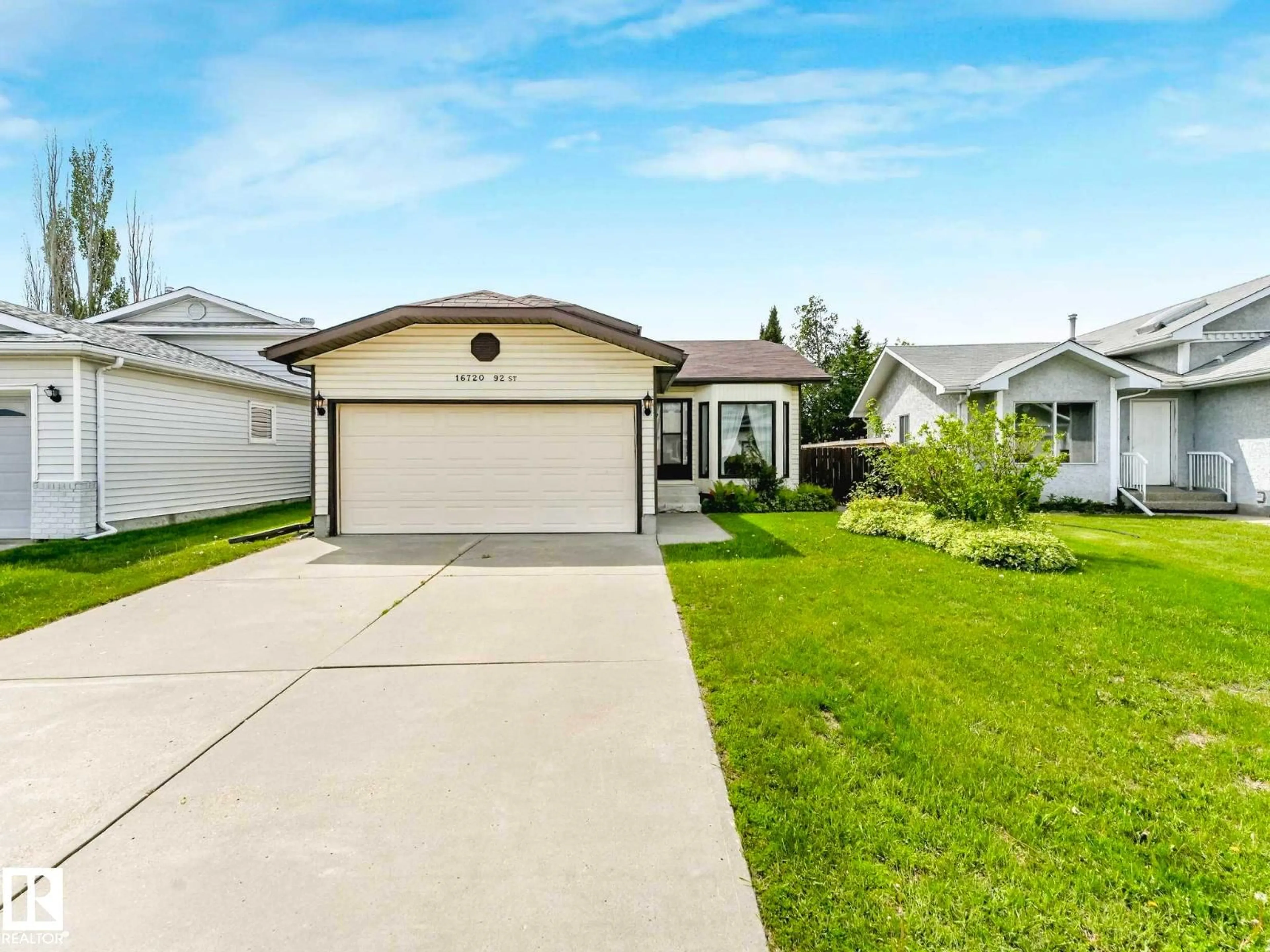 Home with vinyl exterior material, street for NW - 16720 92 ST, Edmonton Alberta T5Z2W2