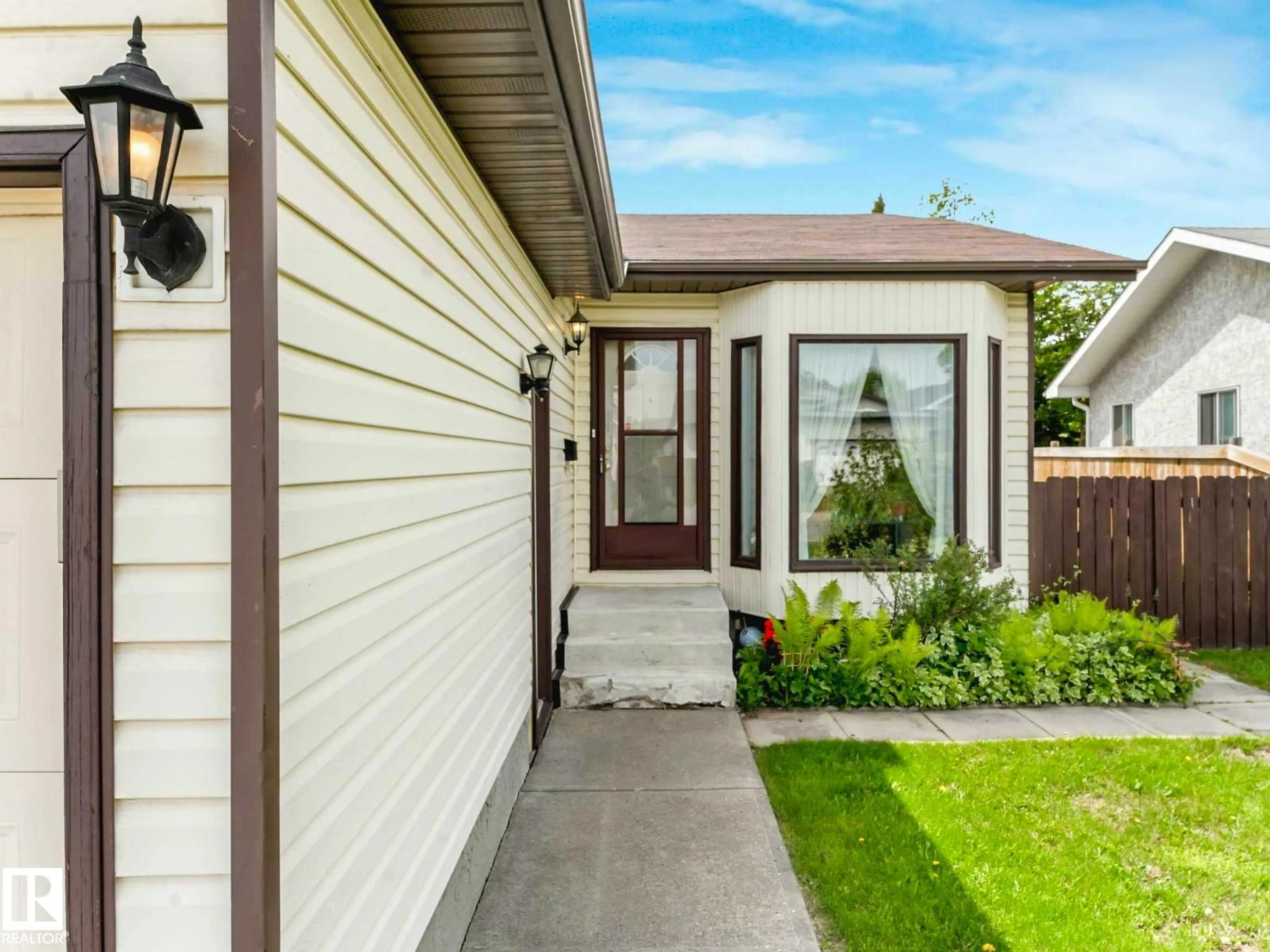 Home with vinyl exterior material, street for NW - 16720 92 ST, Edmonton Alberta T5Z2W2