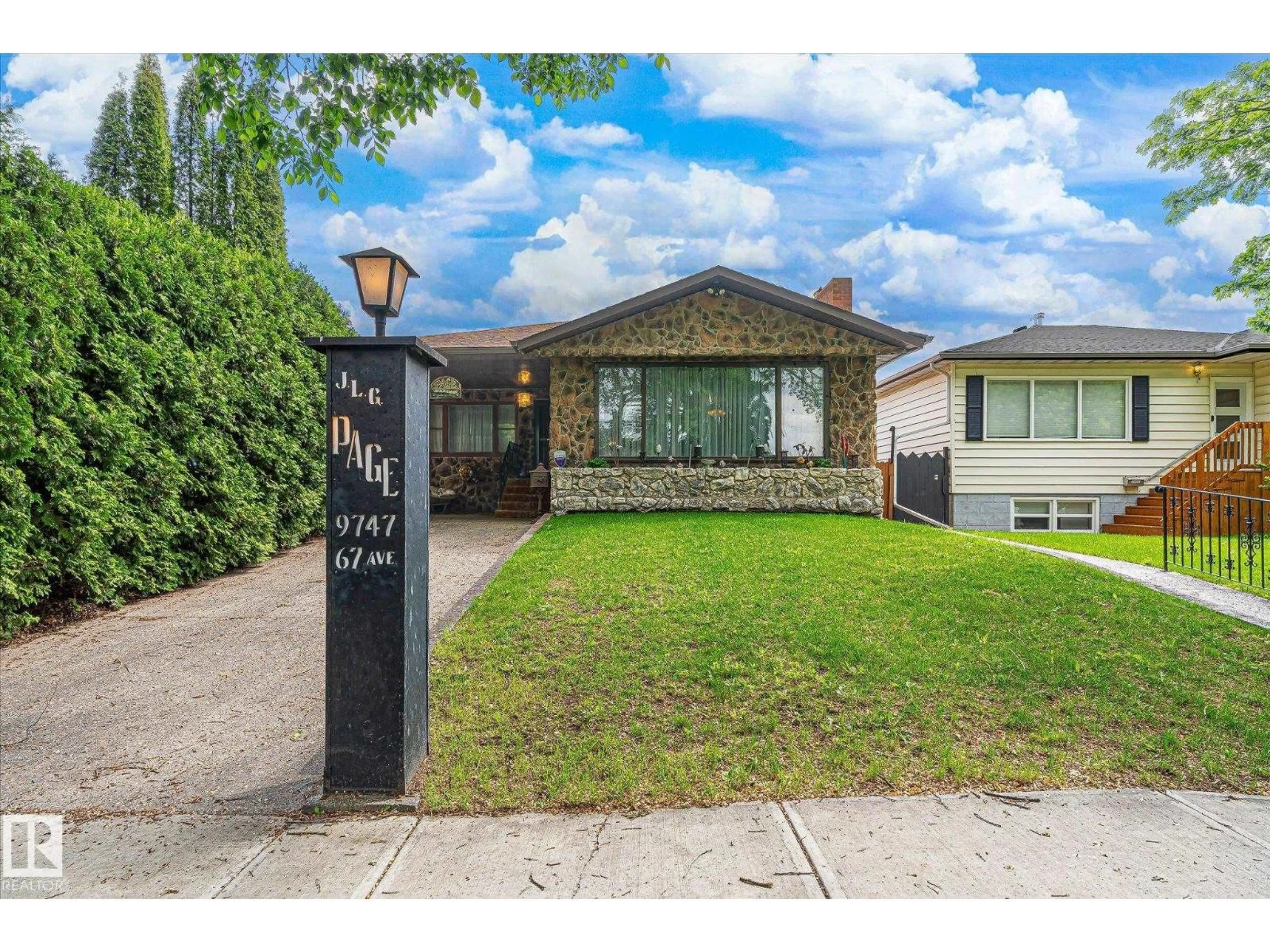 Home with brick exterior material, street for NW - 9747 67 AV, Edmonton Alberta T6E0P1