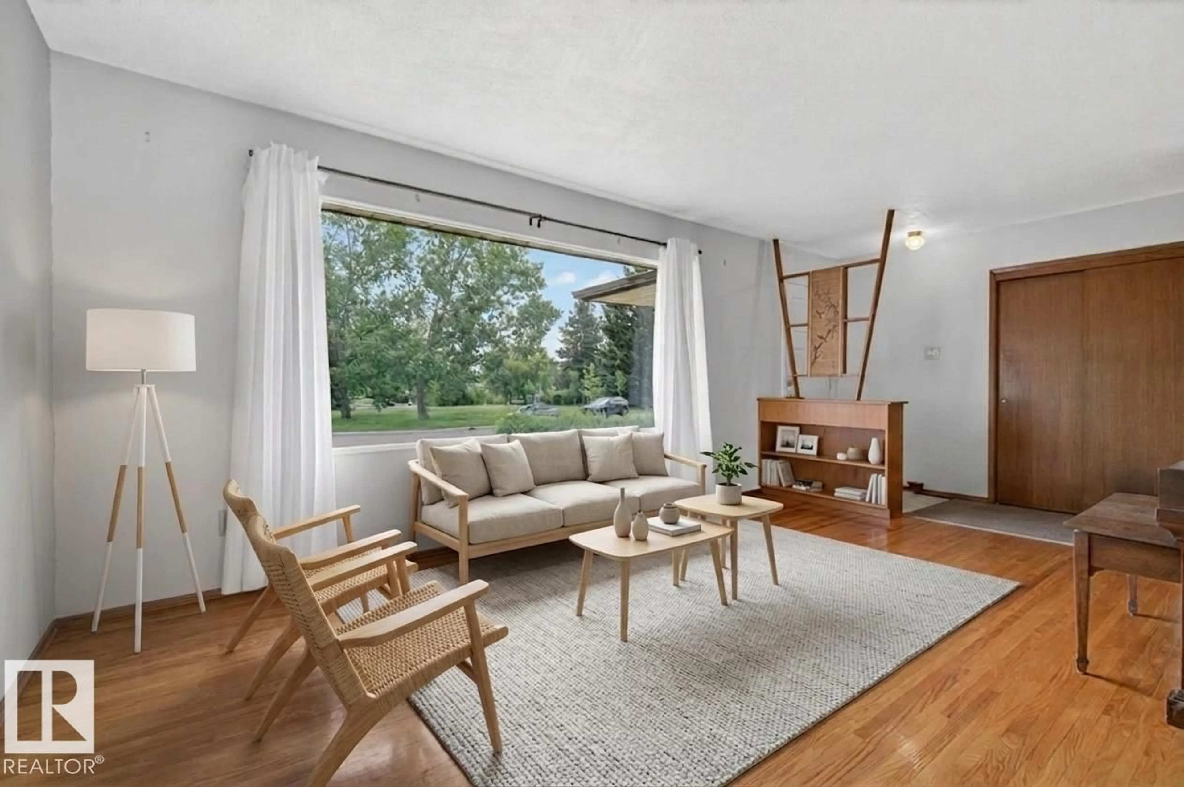 Living room with furniture, wood/laminate floor for NW - 5308 105A ST, Edmonton Alberta T6H2P4