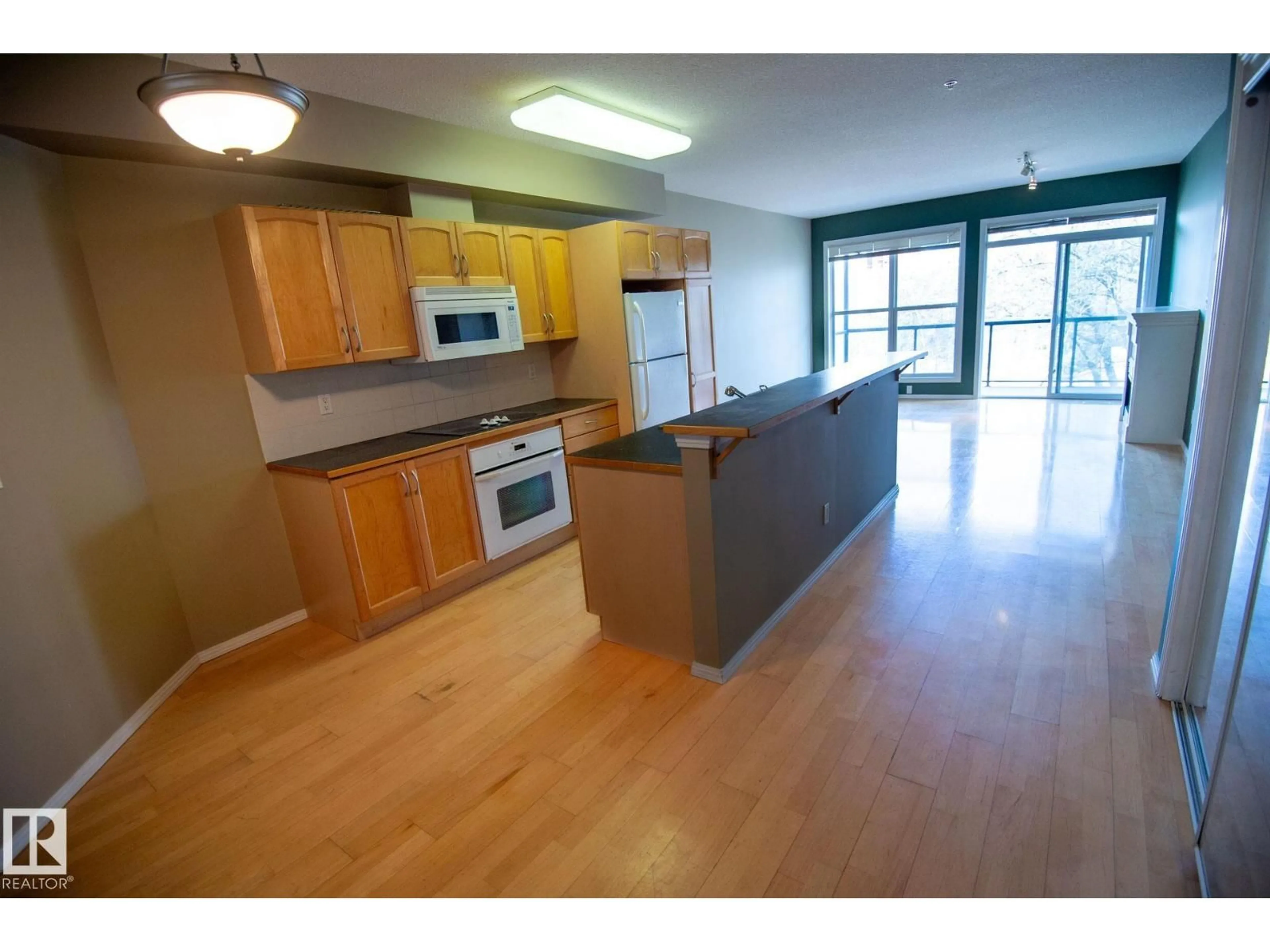 Open concept kitchen, wood/laminate floor for #412 - 11039 83 AV, Edmonton Alberta T6G2V6