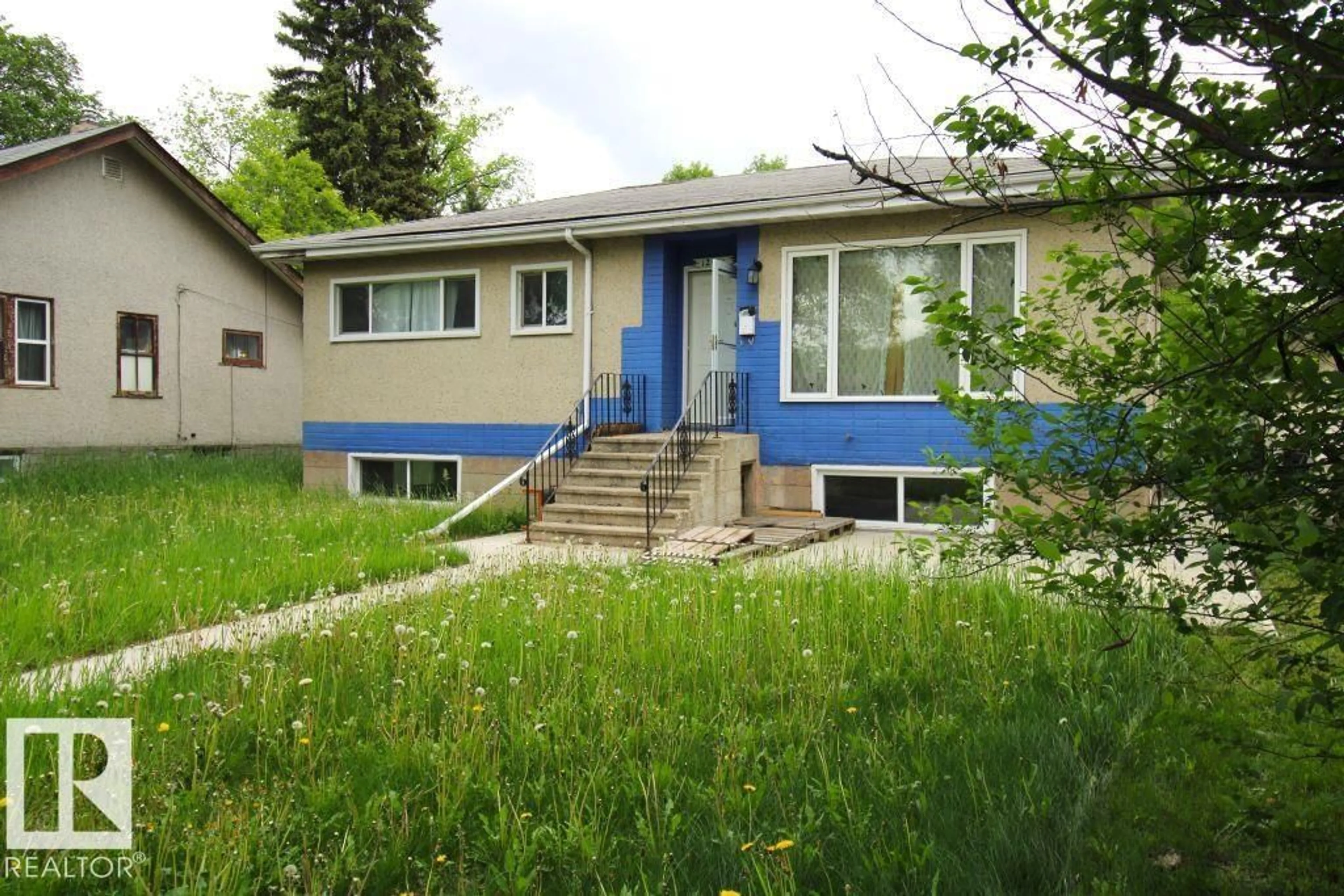Home with vinyl exterior material, street for NW - 12041 86 ST, Edmonton Alberta T5B3K5