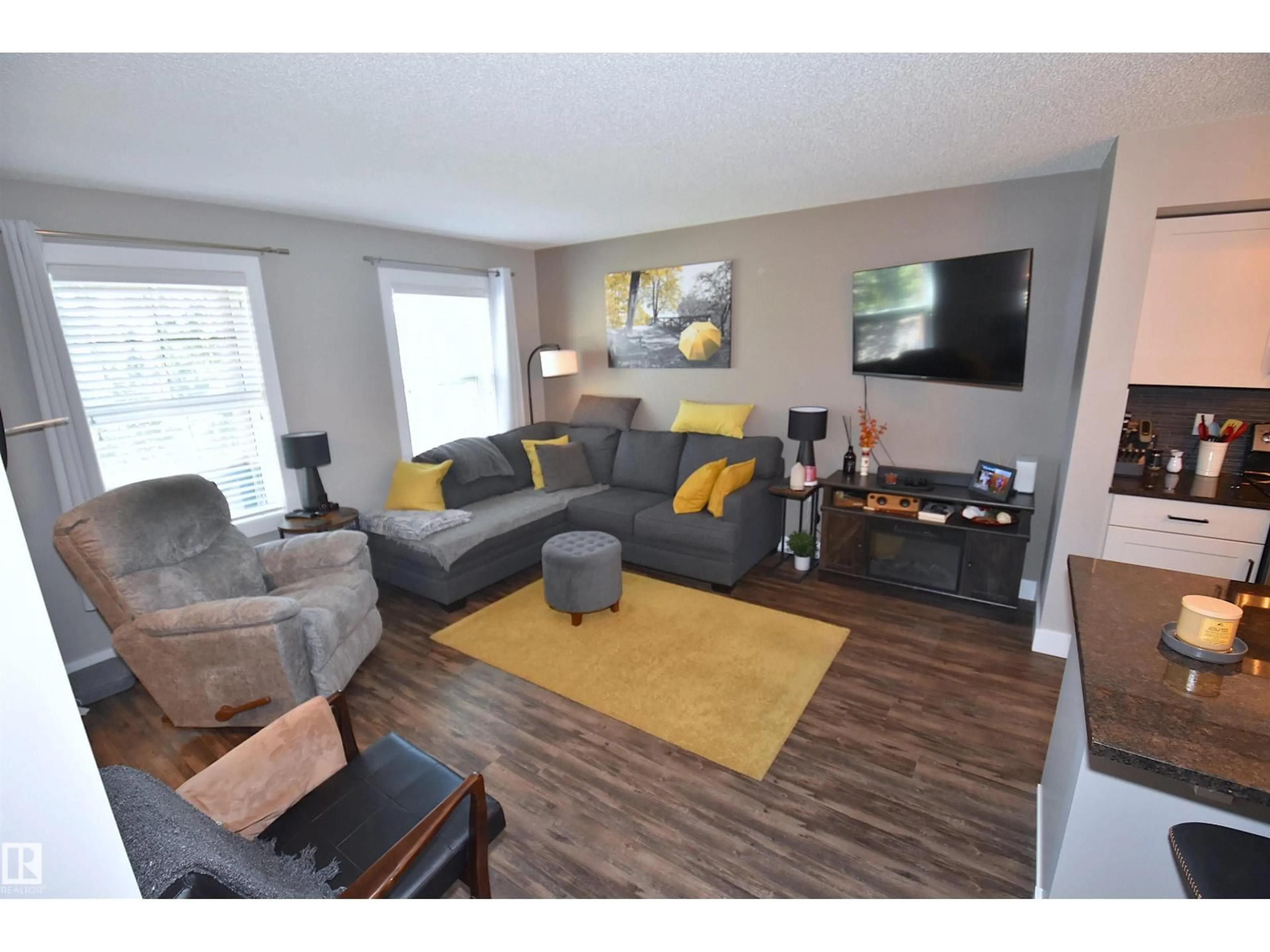 Living room with furniture, wood/laminate floor for 5223 CHAPPELLE RD, Edmonton Alberta T6W2B1