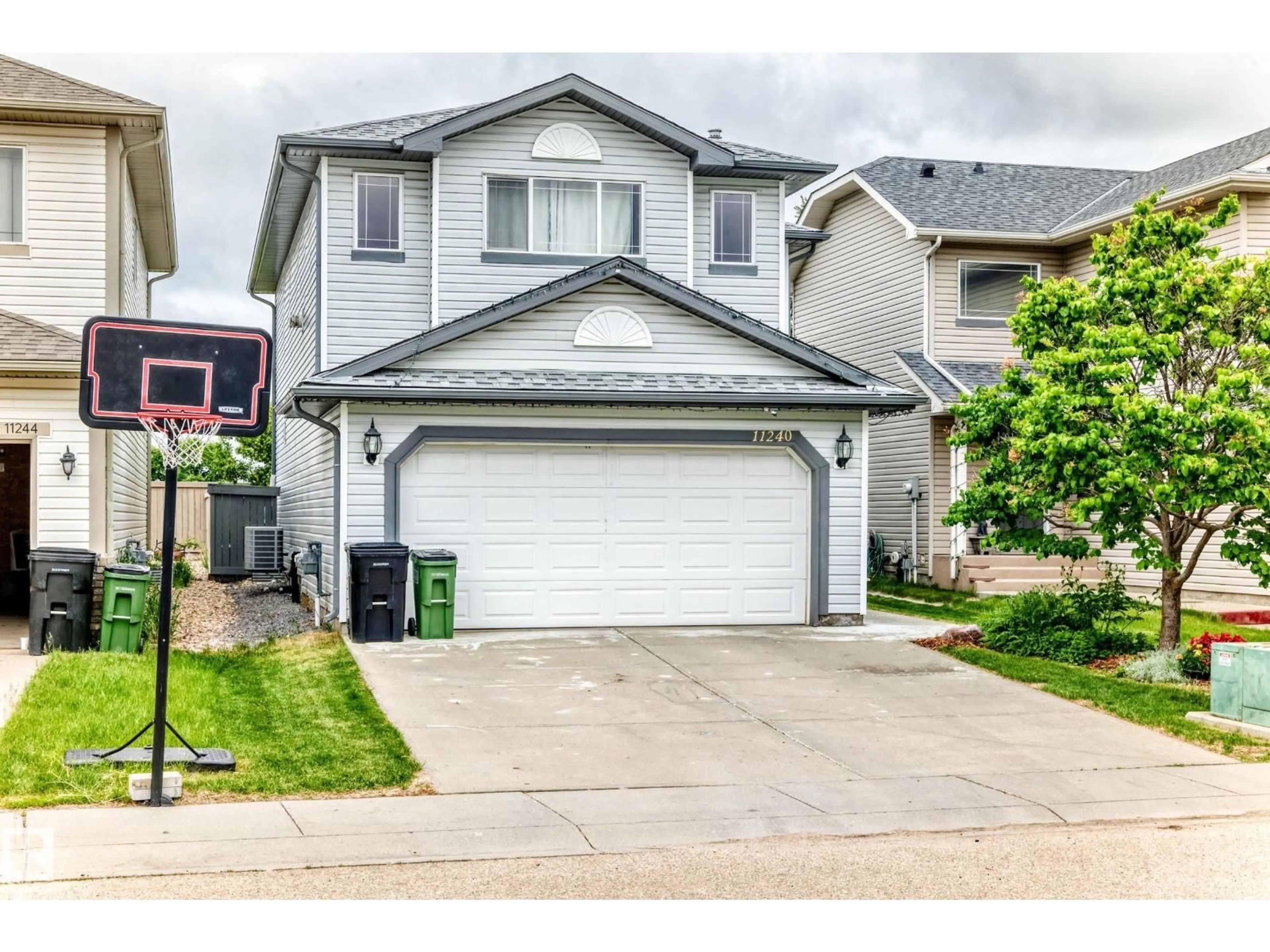 Home with vinyl exterior material, street for 11240 167B AV, Edmonton Alberta T5X6J6