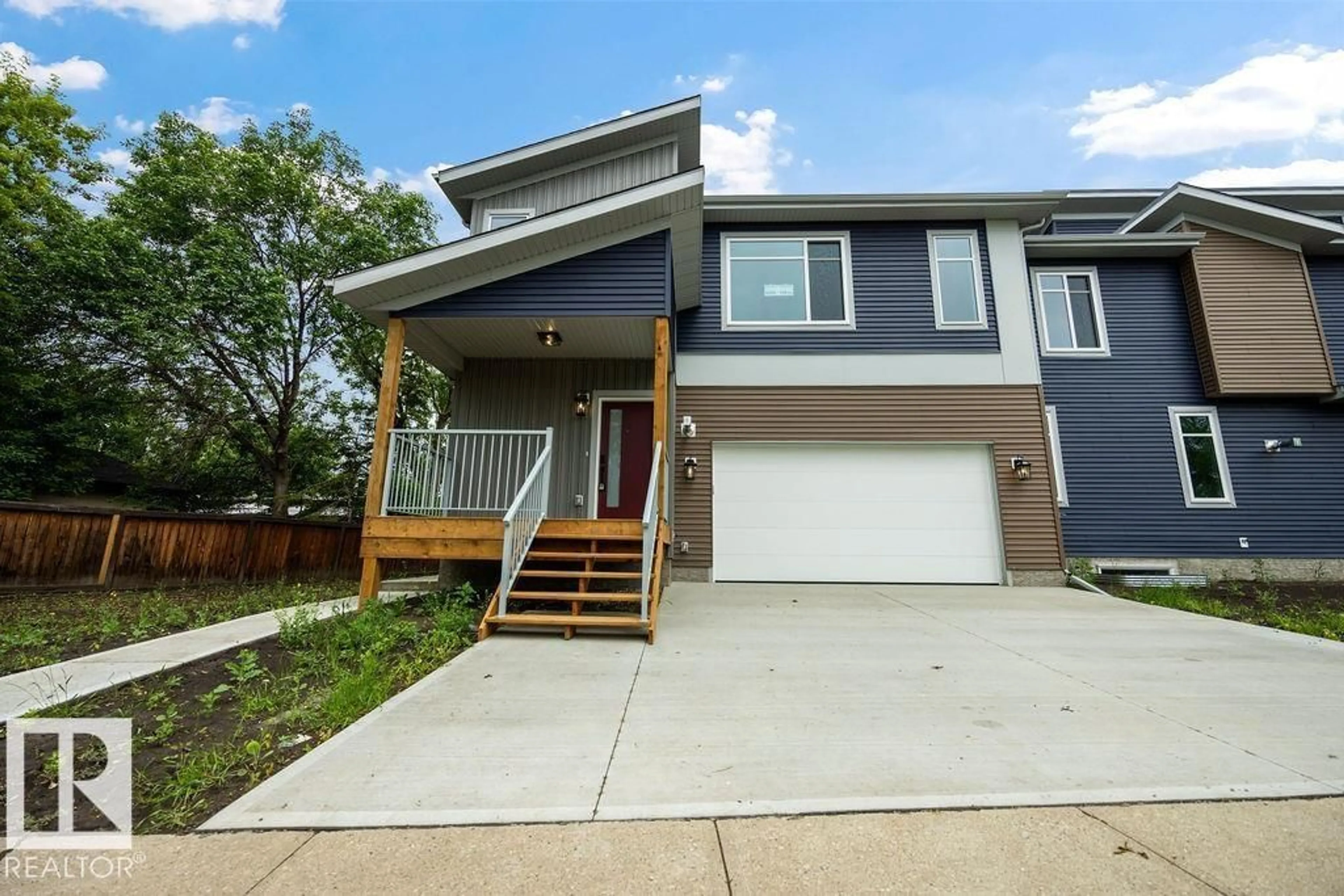 Home with vinyl exterior material, street for NW - 6204 150 AV, Edmonton Alberta T5A1W8