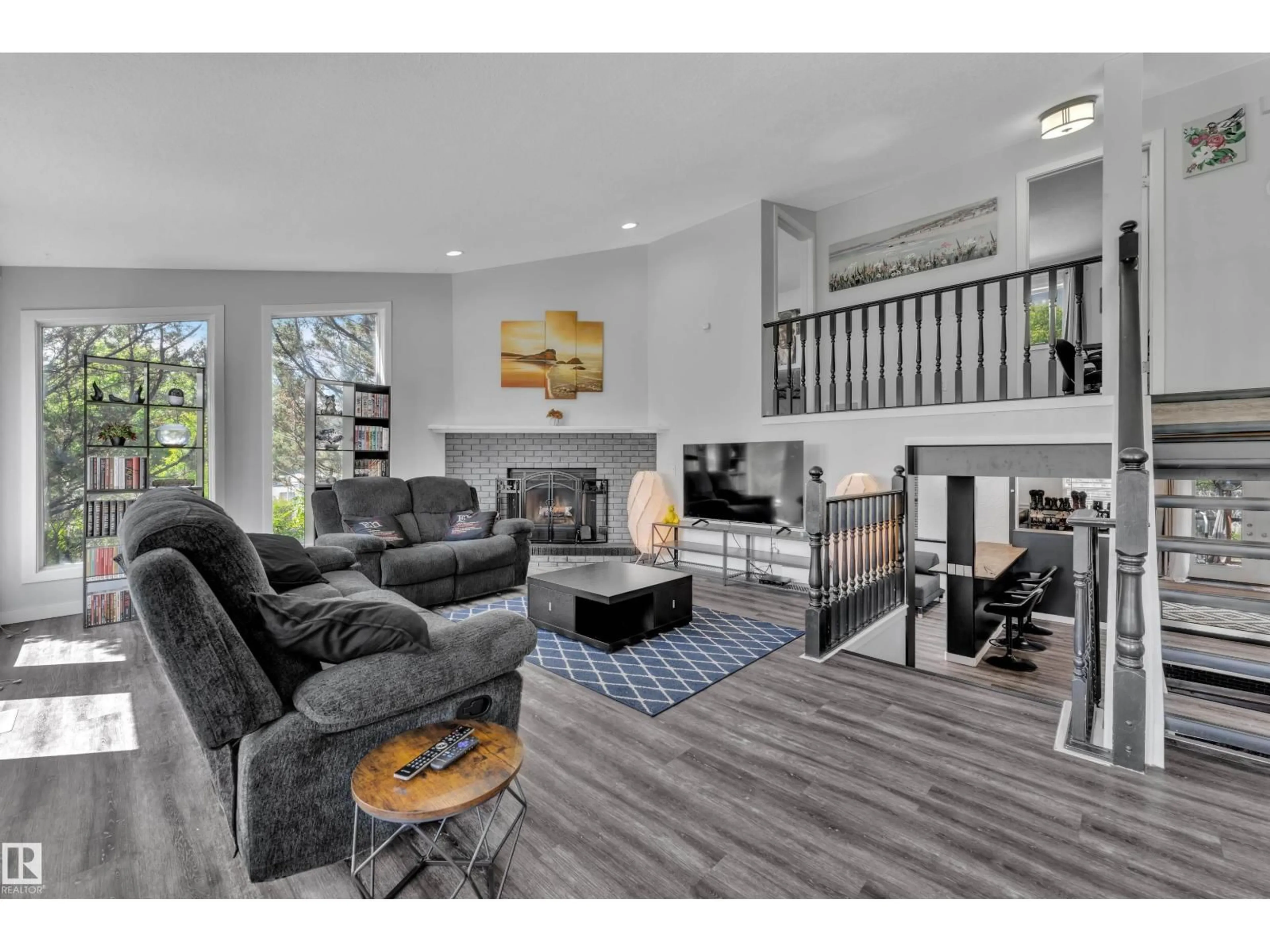 Living room with furniture, wood/laminate floor for 2219 MILLBOURNE RD W, Edmonton Alberta T6K0Y3