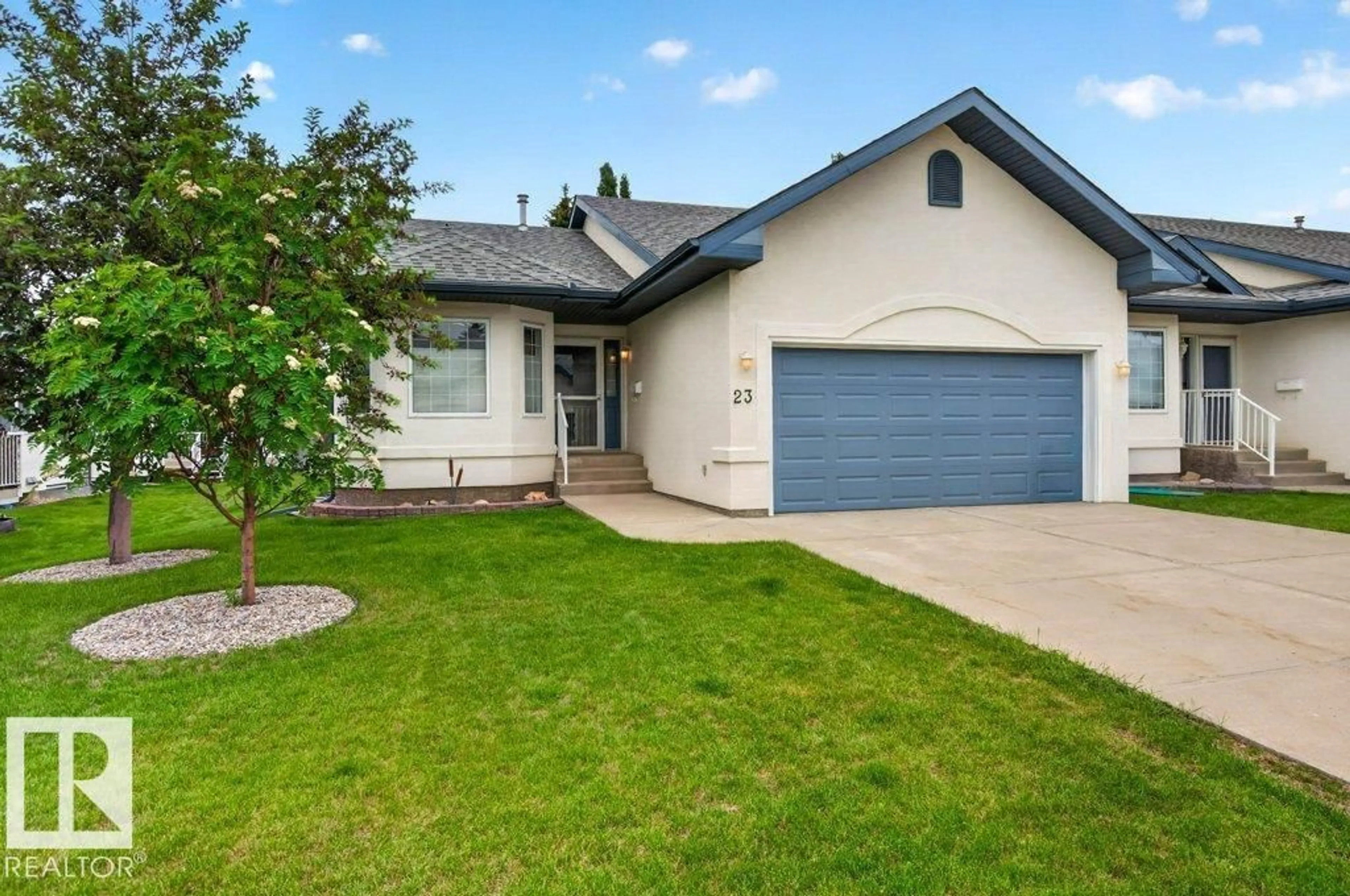 Home with vinyl exterior material, street for 9 - 23 DECHENE RD, Edmonton Alberta T6M2V1