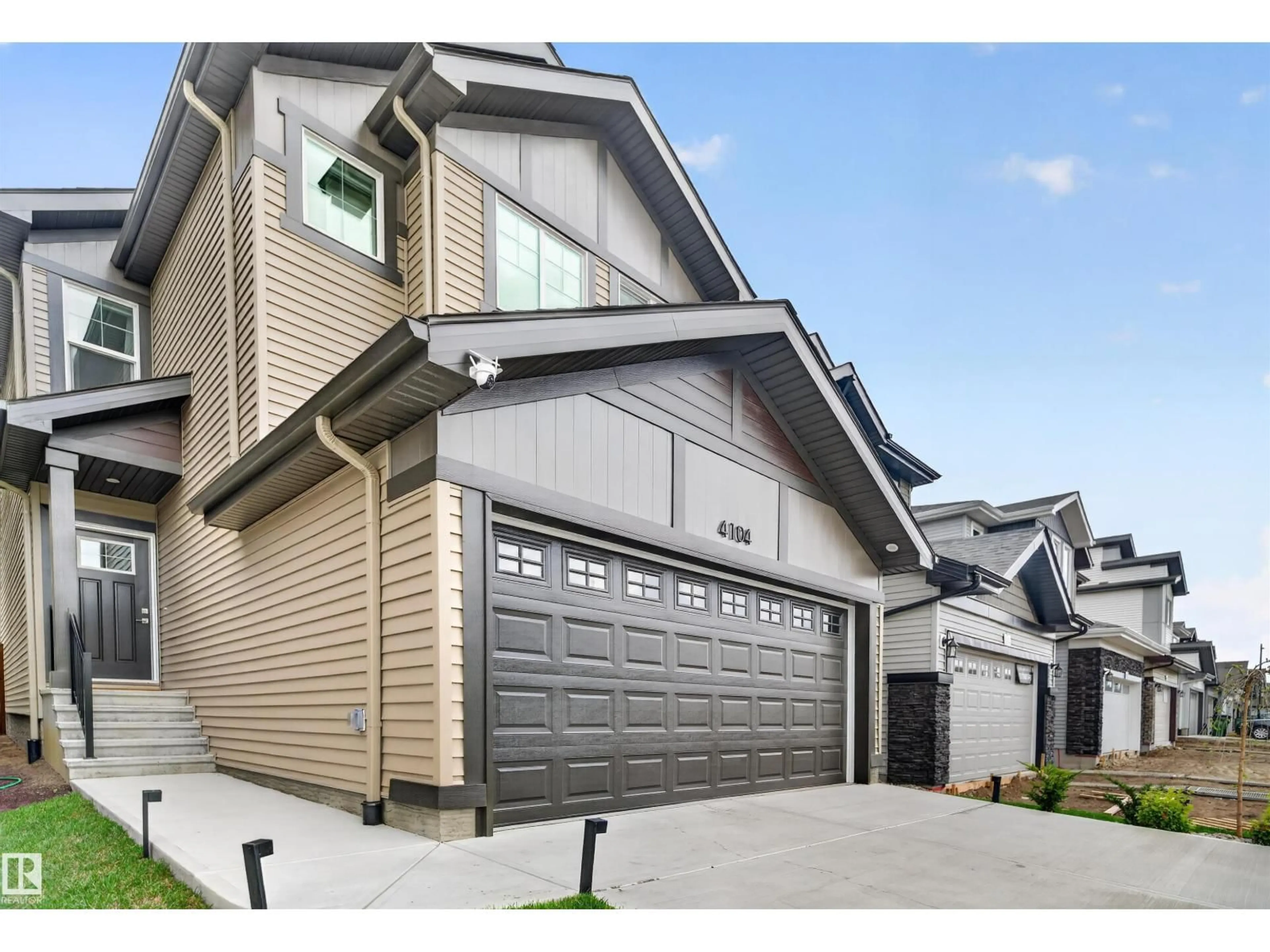Home with vinyl exterior material, street for NW - 4104 208 ST, Edmonton Alberta T6M3E4