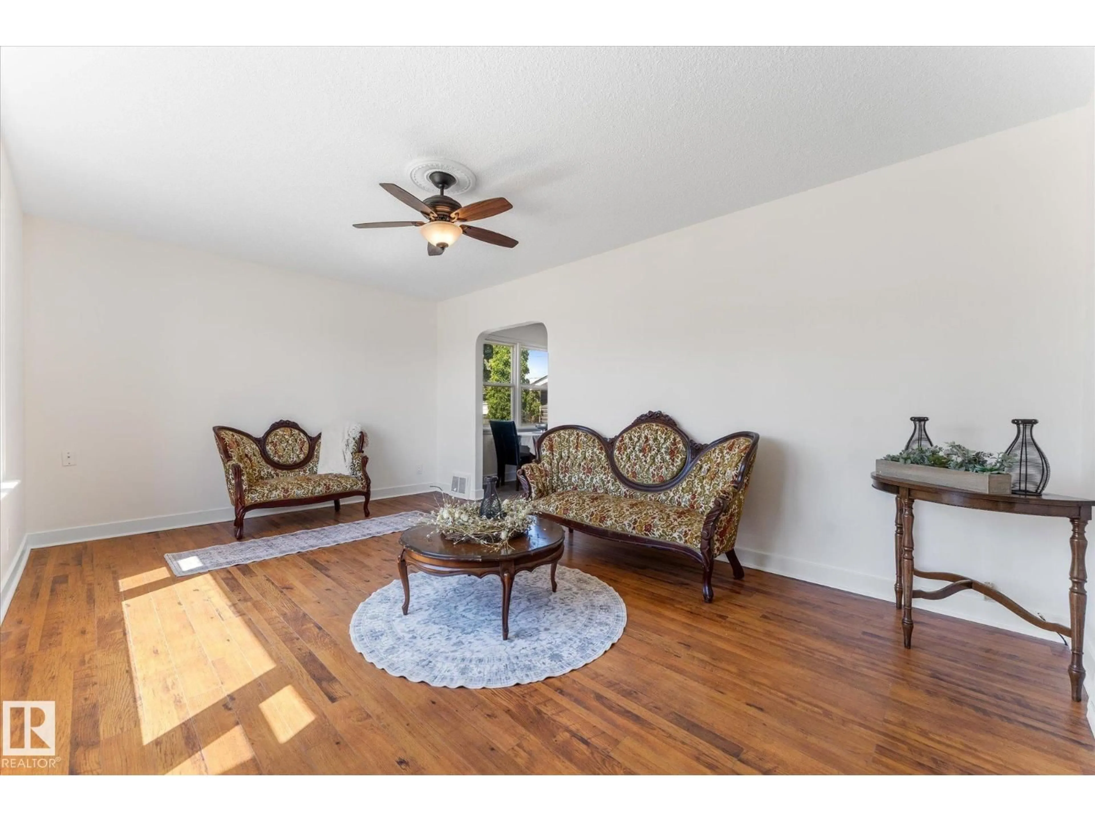 Living room with furniture, wood/laminate floor for 4702 54 A AV, Vegreville Alberta T9C1G2