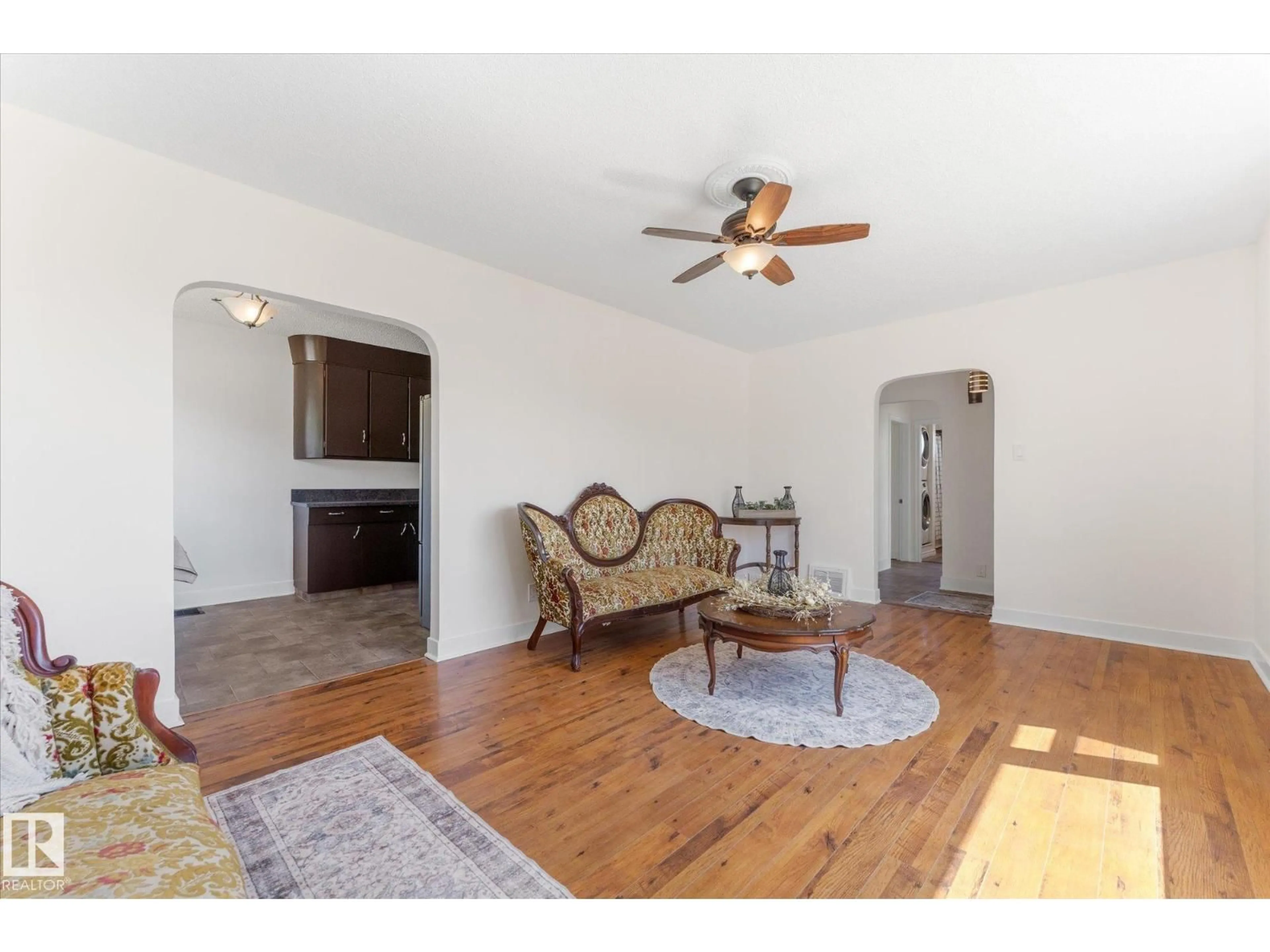 Living room with furniture, wood/laminate floor for 4702 54 A AV, Vegreville Alberta T9C1G2