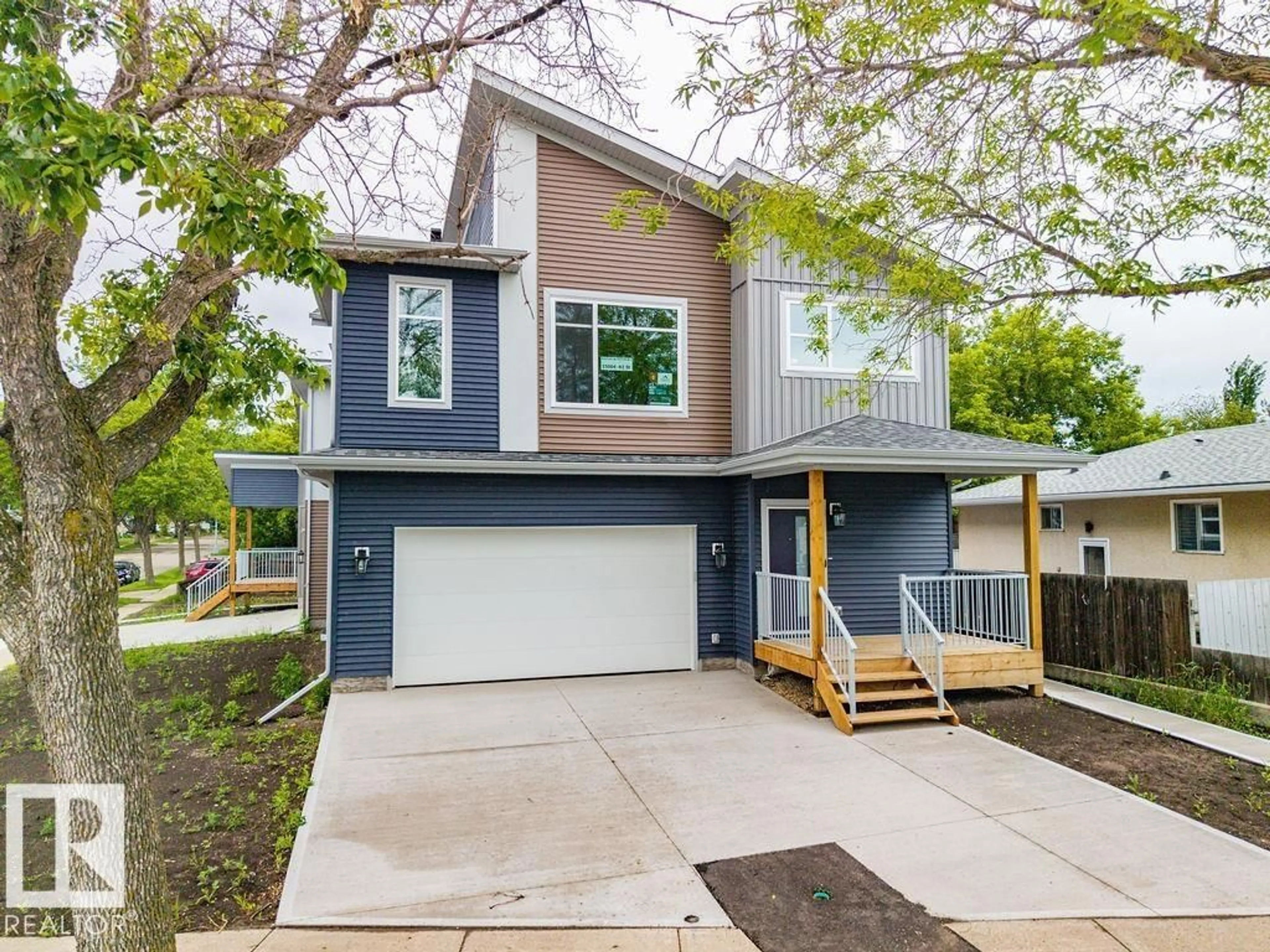 Home with vinyl exterior material, street for NW - 15004 62 ST, Edmonton Alberta T5A1W8