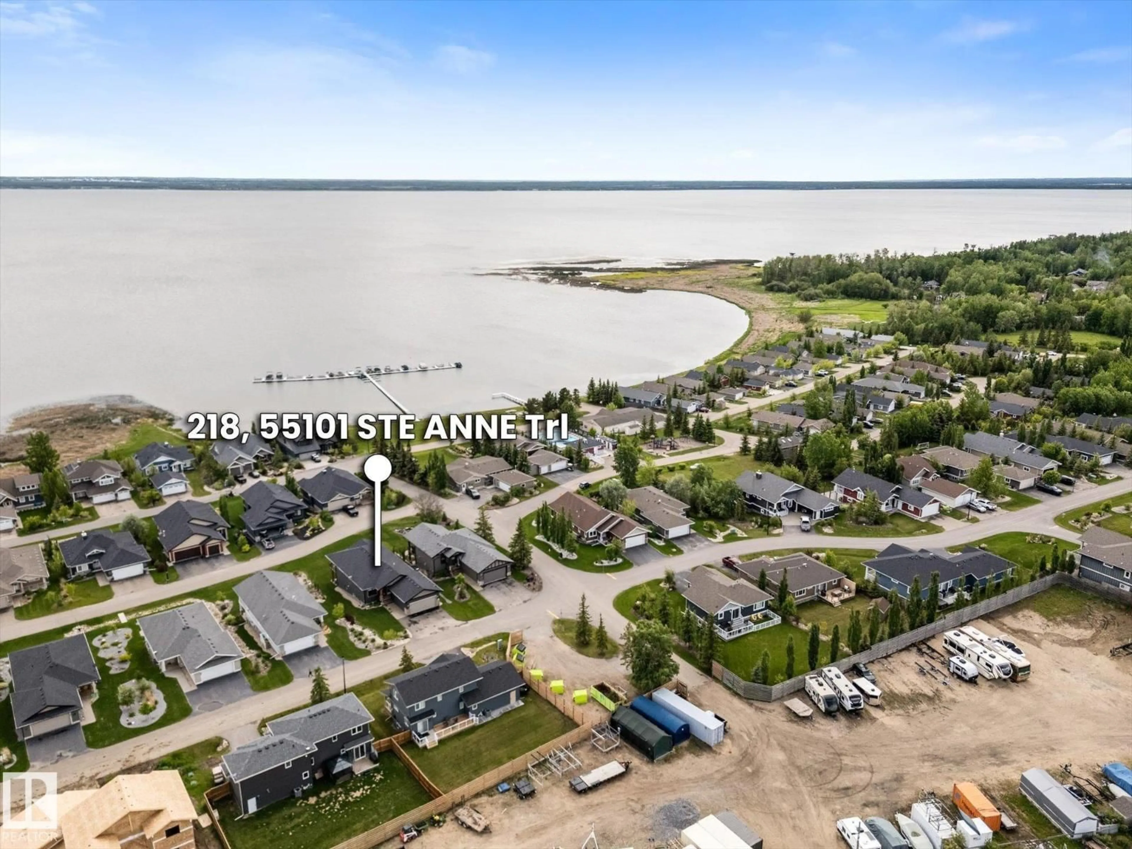 A pic from outside/outdoor area/front of a property/back of a property/a pic from drone, water/lake/river/ocean view for 55101 - 218 STE ANNE TRAIL, Rural Lac Ste. Anne County Alberta T0E1A1
