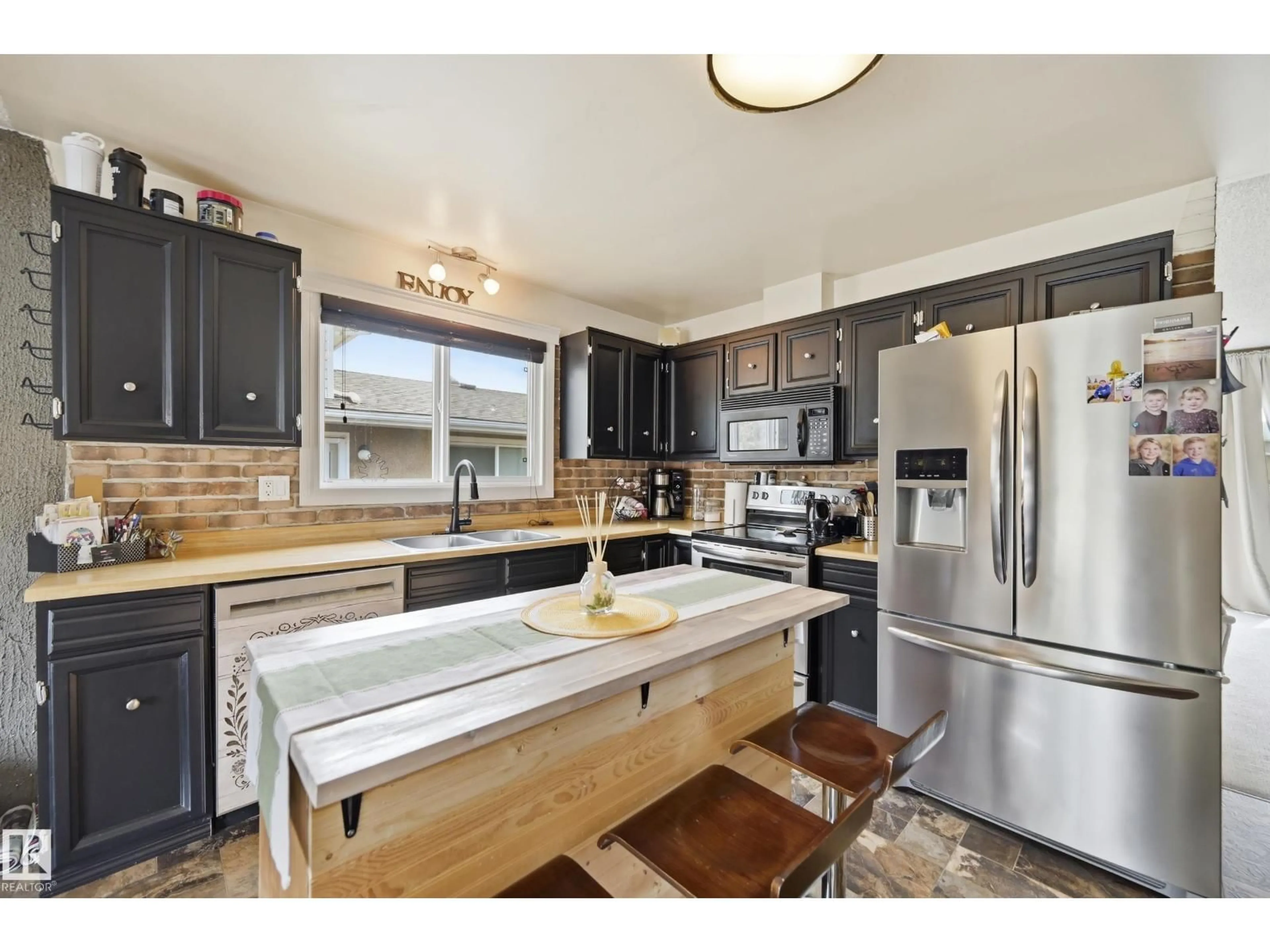 Open concept kitchen, wood/laminate floor for 29 WINCHESTER AV, Spruce Grove Alberta T7X1L5