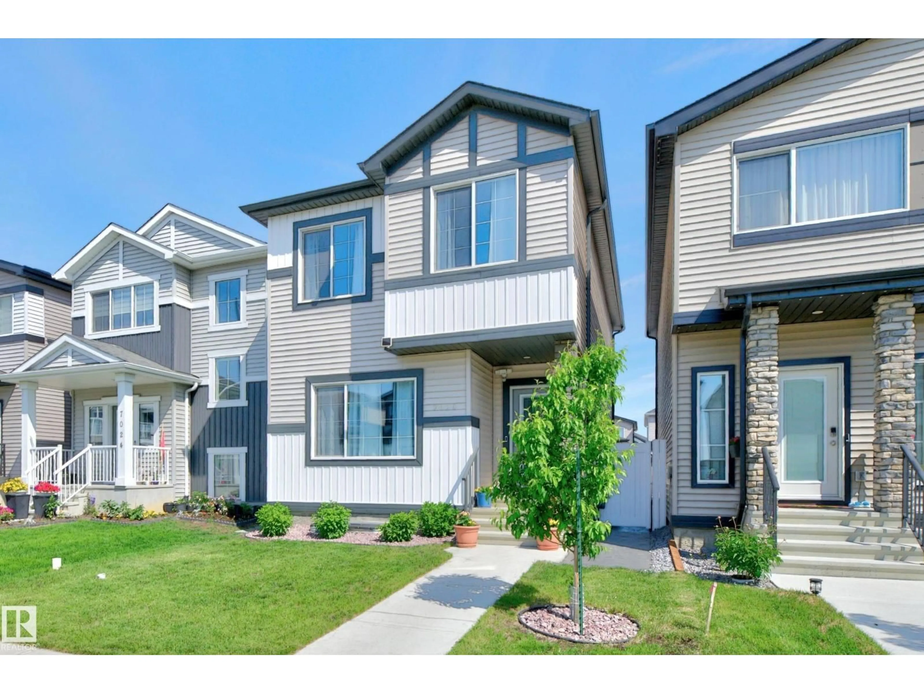 Home with vinyl exterior material, street for 7020 181 AV, Edmonton Alberta T5Z0V5