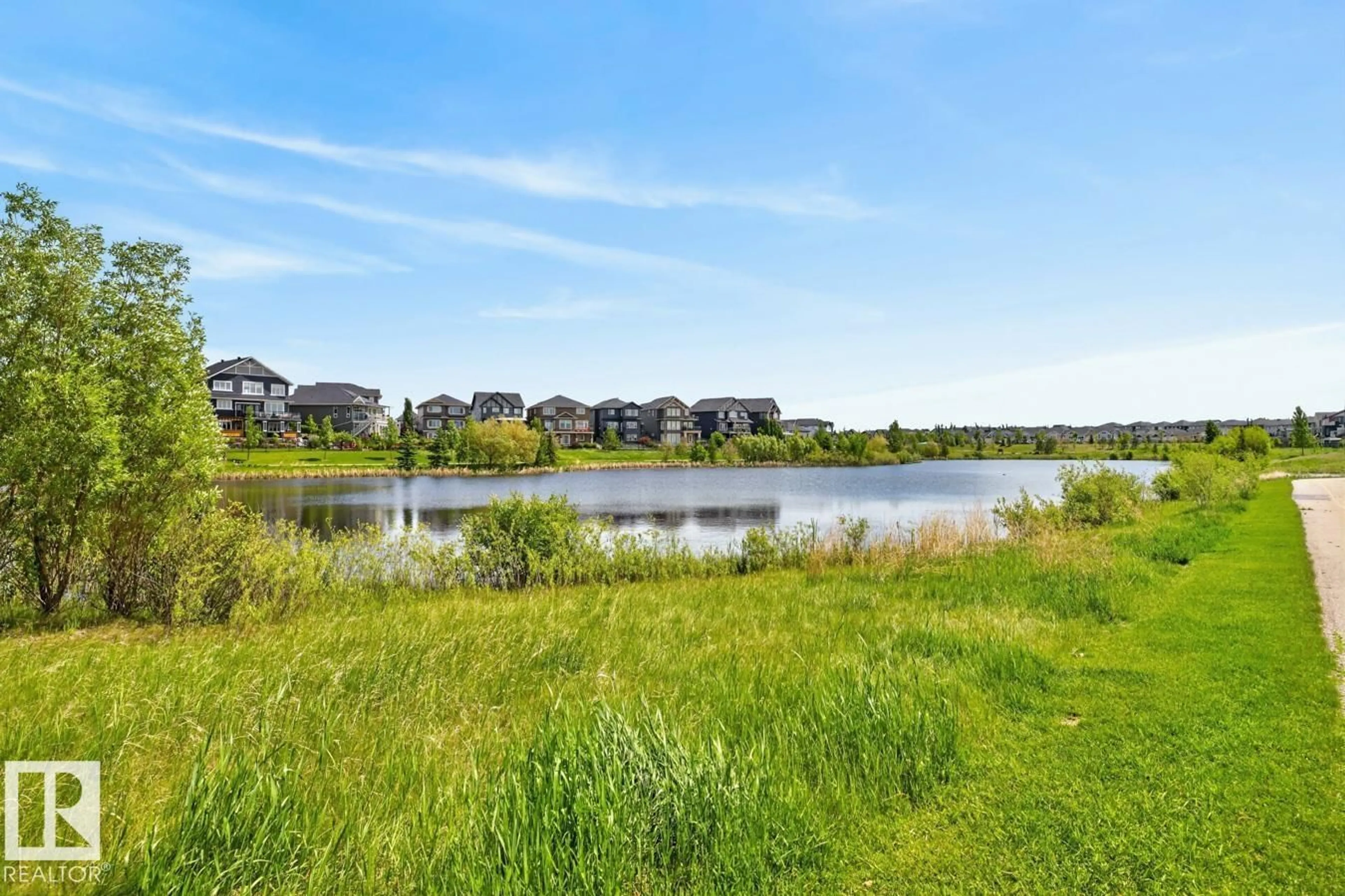 A pic from outside/outdoor area/front of a property/back of a property/a pic from drone, water/lake/river/ocean view for 50 - 105 EBONY BV, Sherwood Park Alberta T8H2X4