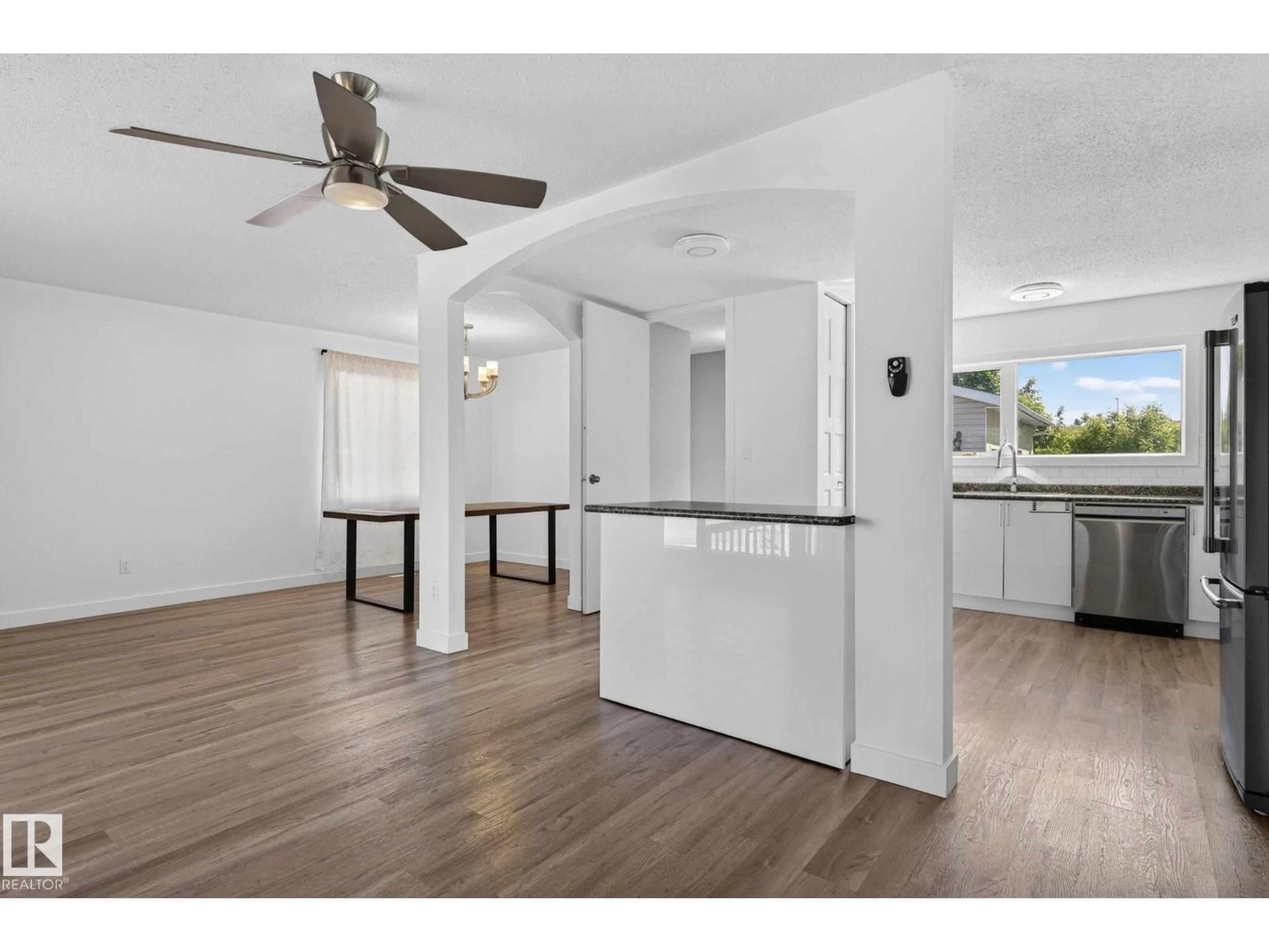 Open concept kitchen, wood/laminate floor for 3119 104 ST, Edmonton Alberta T6J3B2
