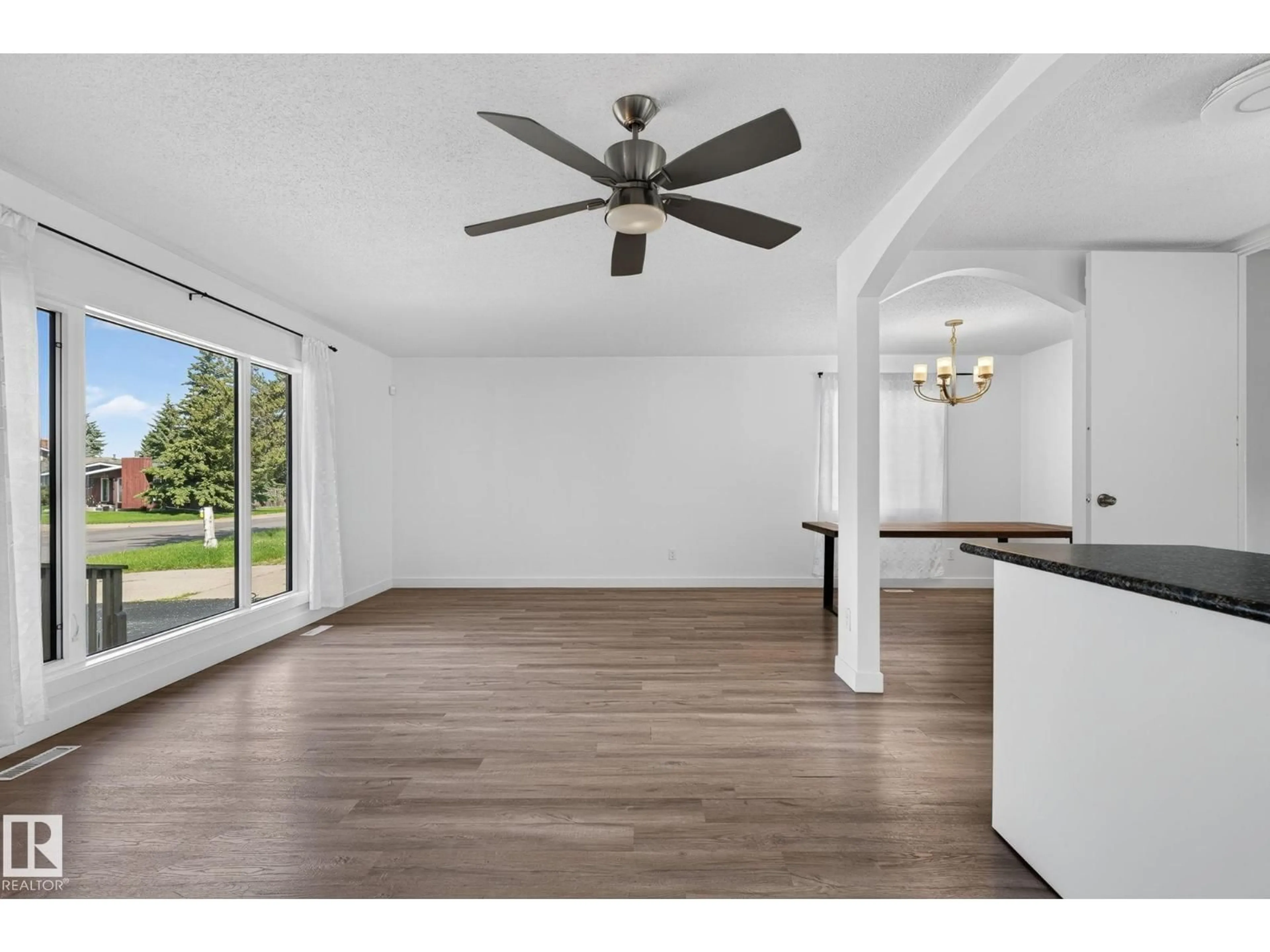 Open concept kitchen, wood/laminate floor for 3119 104 ST, Edmonton Alberta T6J3B2