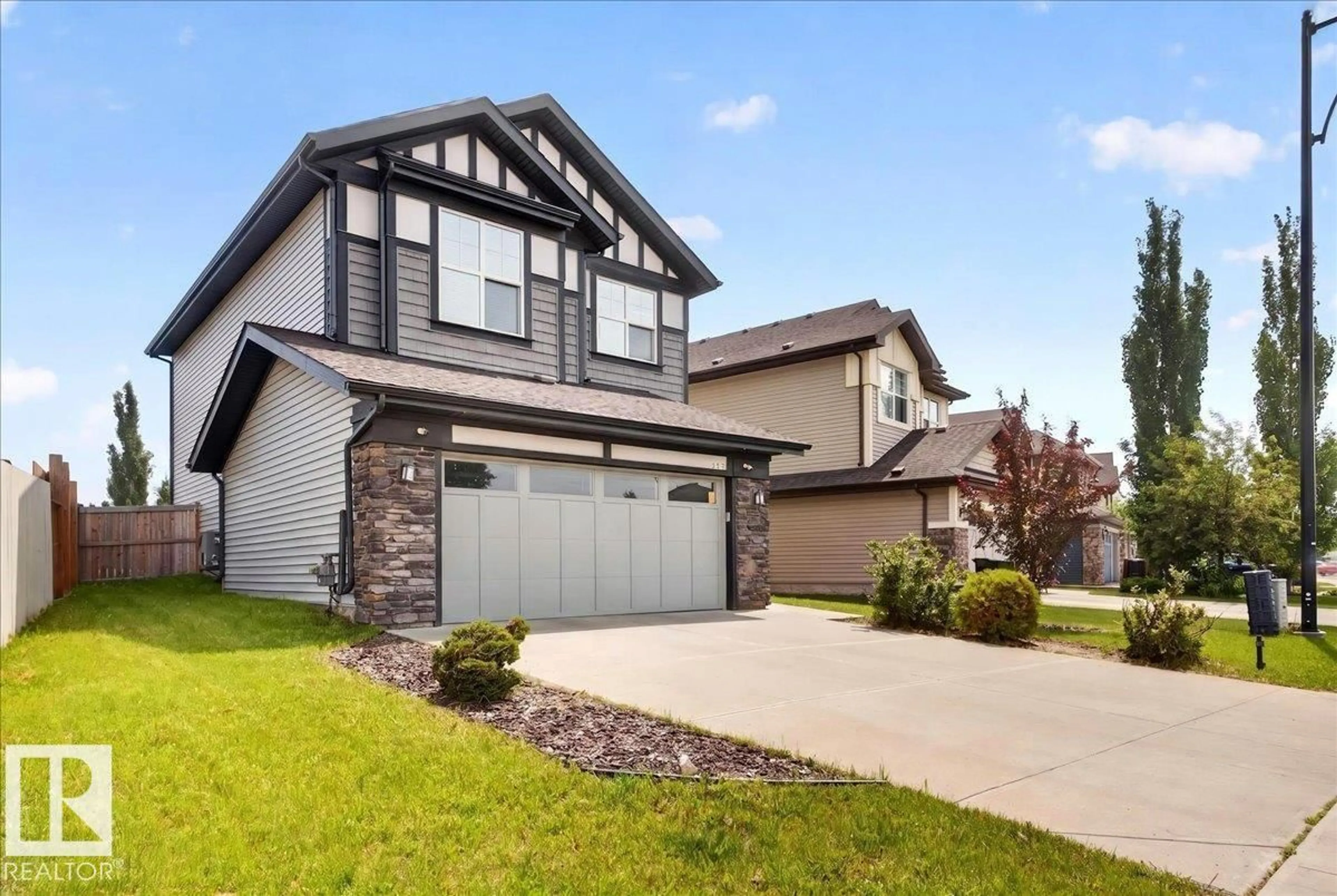 Home with vinyl exterior material, street for 17203 71 ST, Edmonton Alberta T5Z0H1
